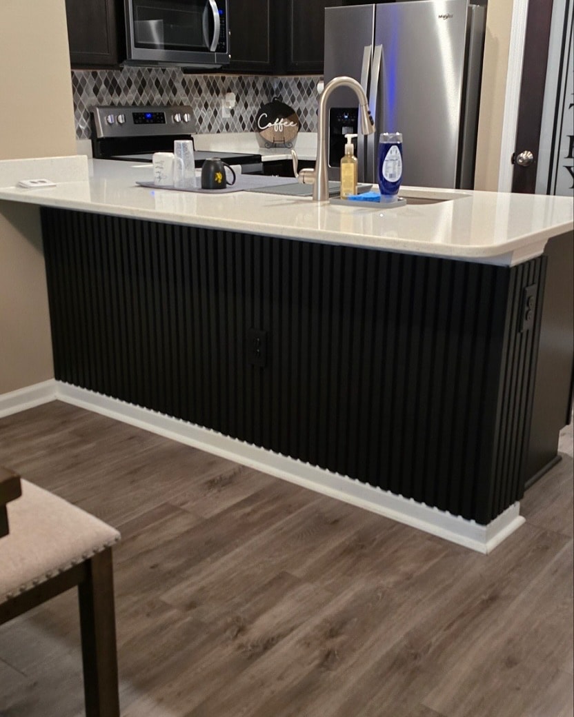 Painted shiplap feature wall, custom-built for the space, by AVP Construction JAX in Jacksonville & St. Johns County, FL