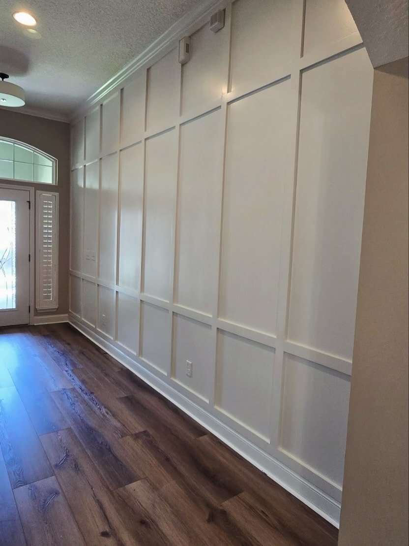 Wainscoting feature wall with chair rail, custom-built for the space, by AVP Construction JAX in Jacksonville & St. Johns County, FL