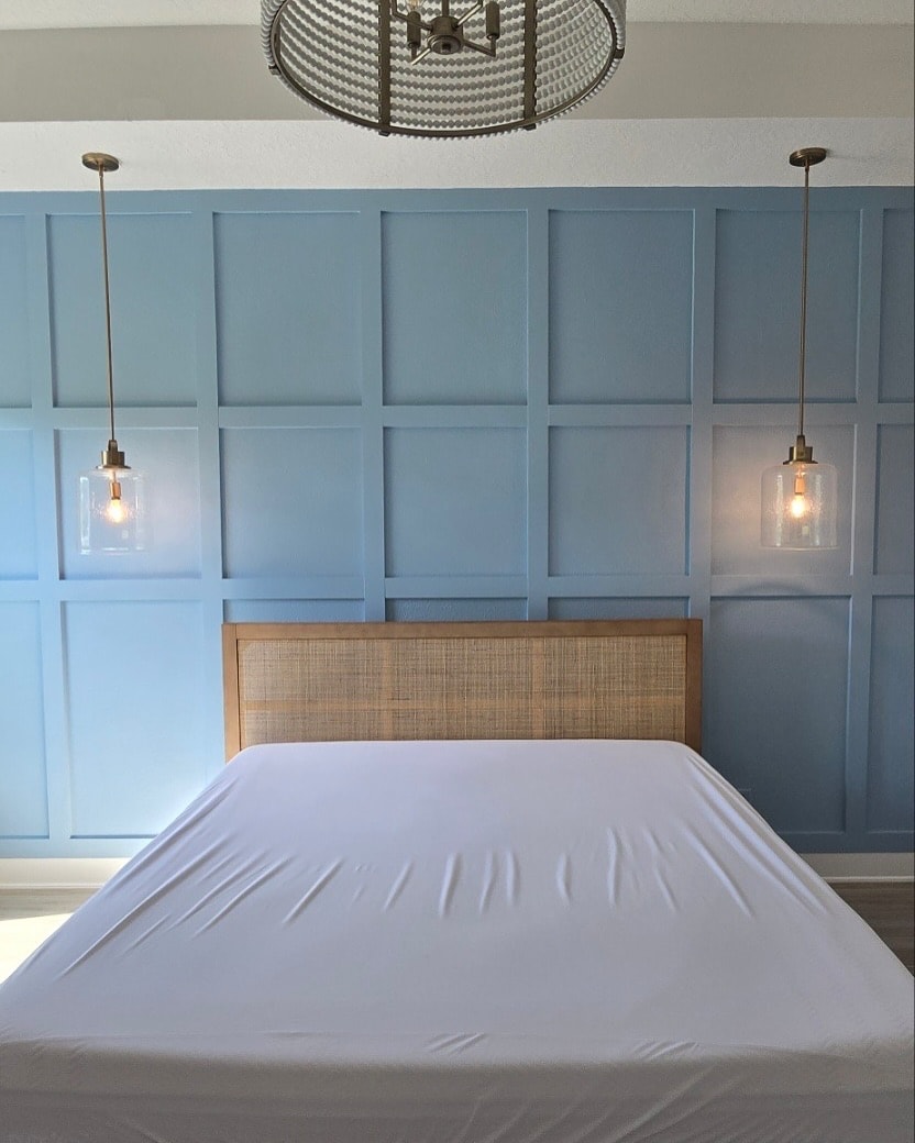 Floor-to-ceiling slat accent wall, custom-built for the space, by AVP Construction JAX in Jacksonville & St. Johns County, FL