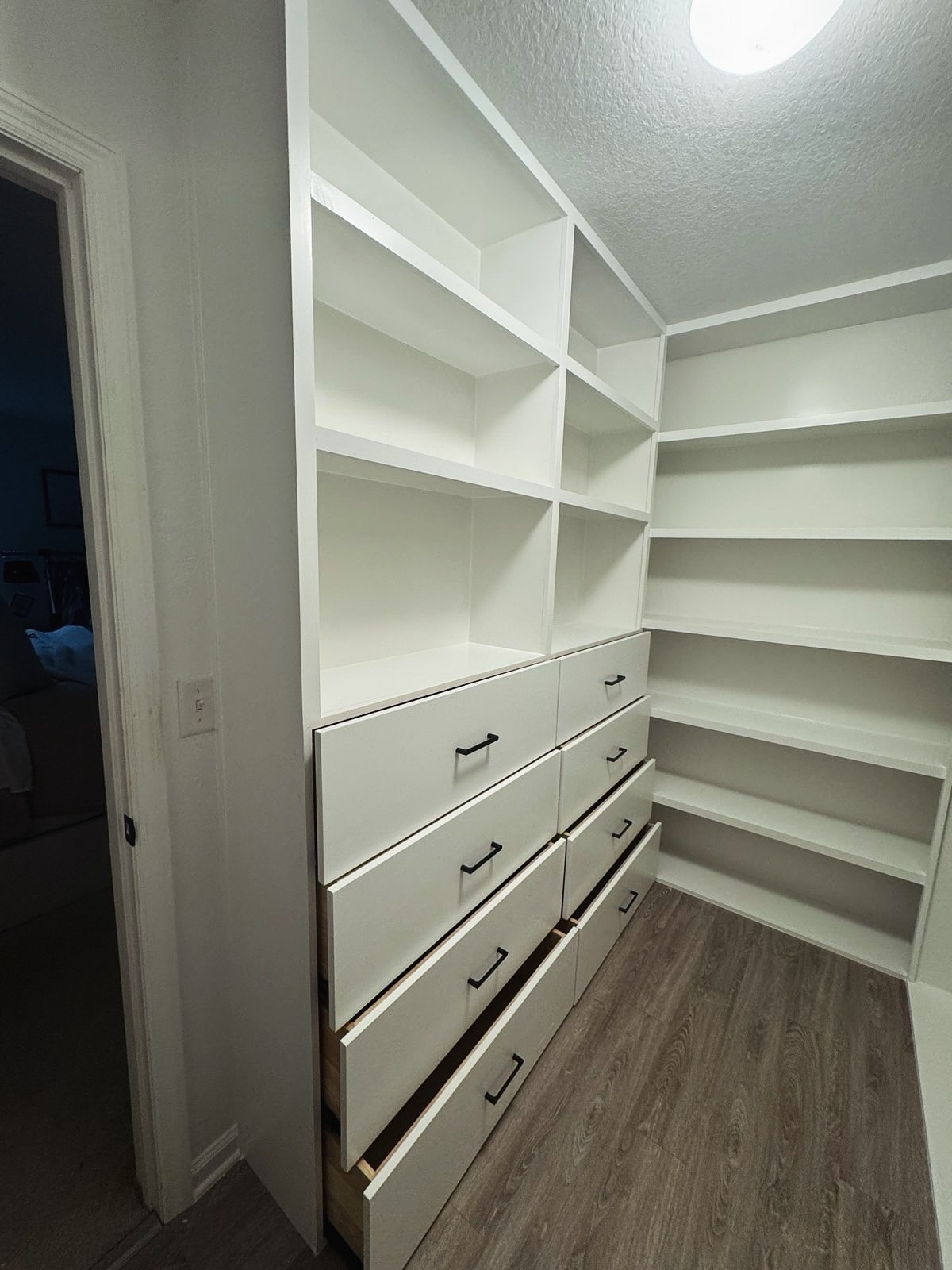 Custom walk-in closet built-in, custom-built for the space, by AVP Construction JAX in Jacksonville & St. Johns County, FL