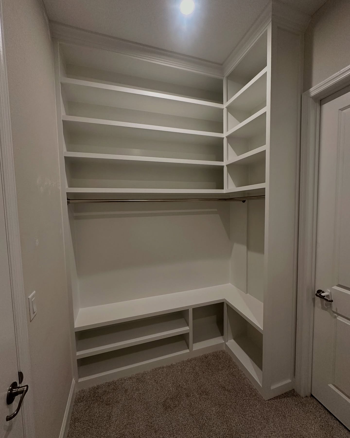 Master closet with island storage, custom-built for the space, by AVP Construction JAX in Jacksonville & St. Johns County, FL