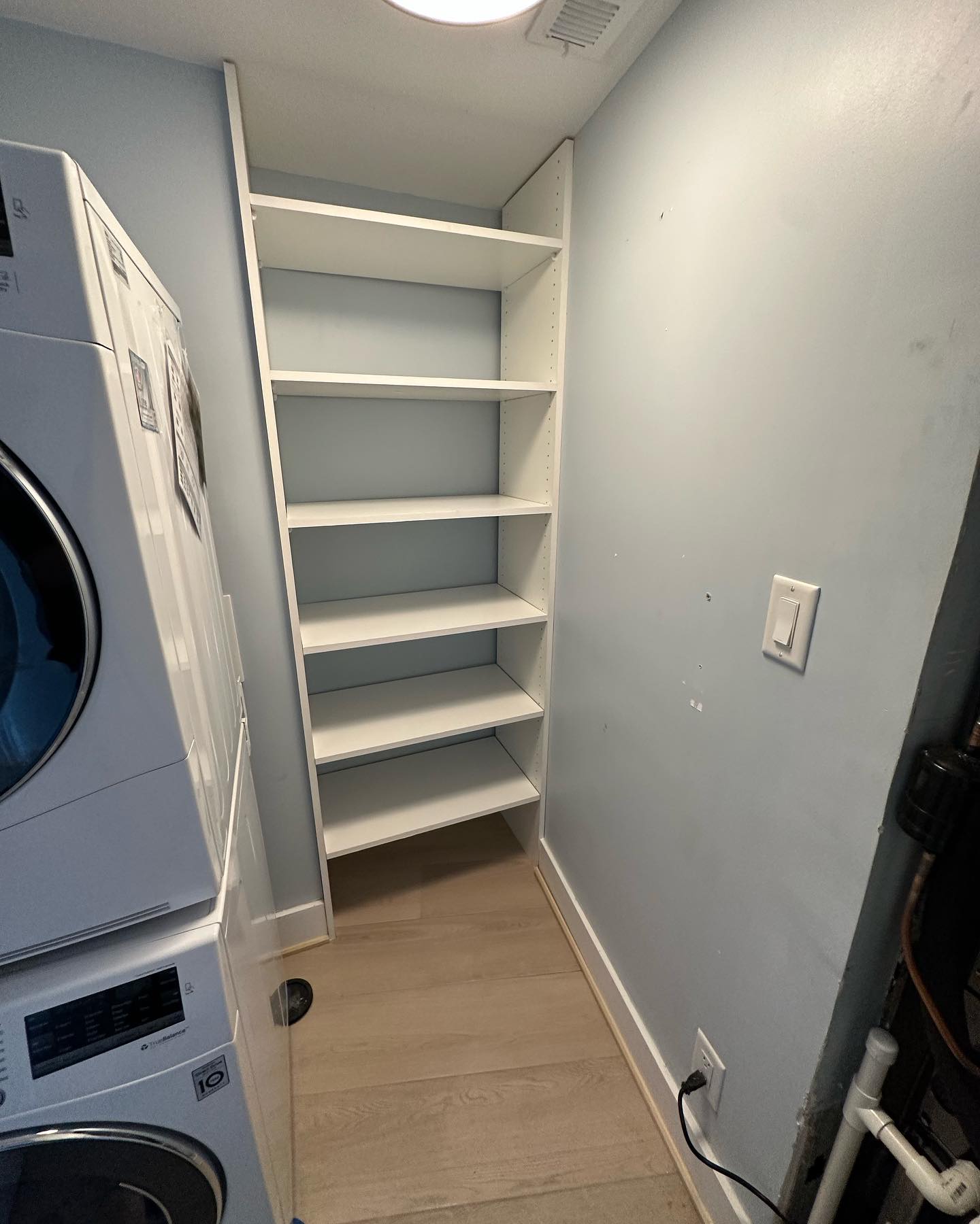 Custom closet system with drawers and hanging, custom-built for the space, by AVP Construction JAX in Jacksonville & St. Johns County, FL