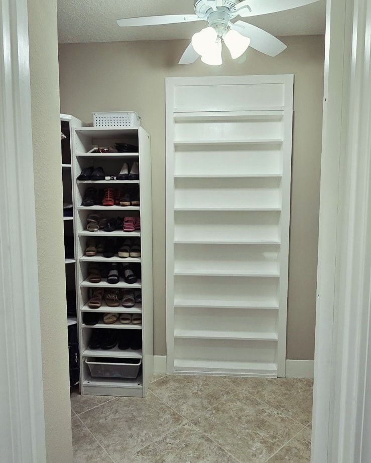 Custom shoe shelving in master closet, custom-built for the space, by AVP Construction JAX in Jacksonville & St. Johns County, FL