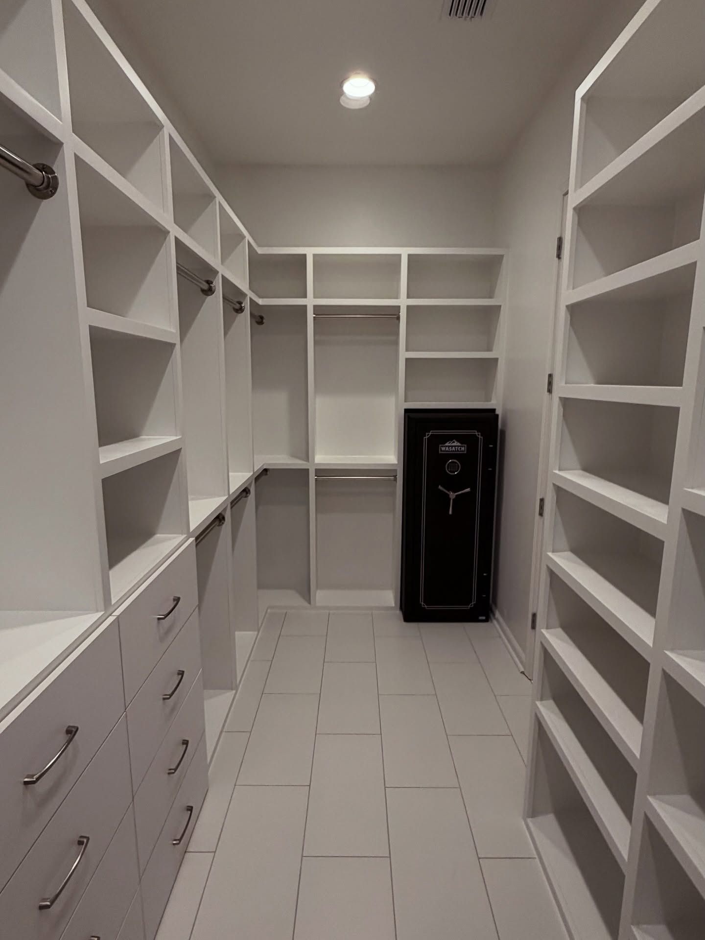 Wardrobe-style custom closet, custom-built for the space, by AVP Construction JAX in Jacksonville & St. Johns County, FL