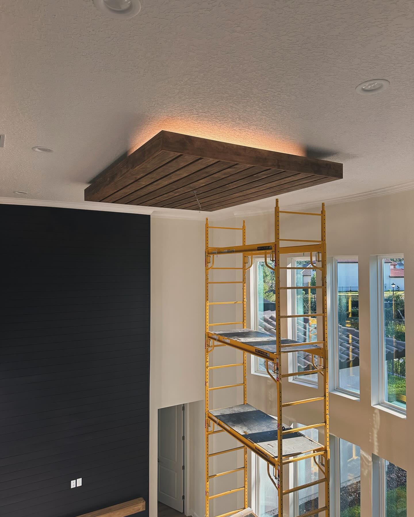 Stained wood plank ceiling, custom-built for the space, by AVP Construction JAX in Jacksonville & St. Johns County, FL