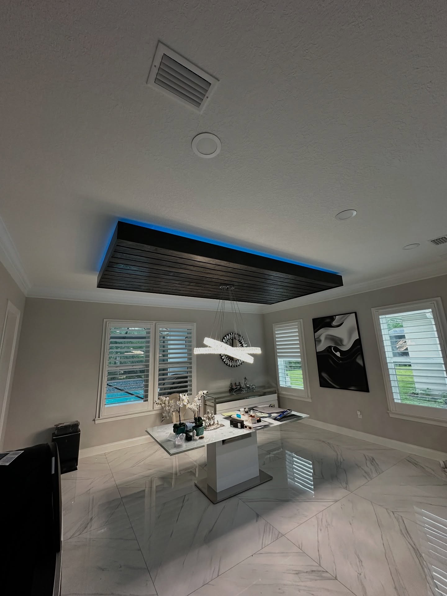 Tray ceiling with custom trim, custom-built for the space, by AVP Construction JAX in Jacksonville & St. Johns County, FL