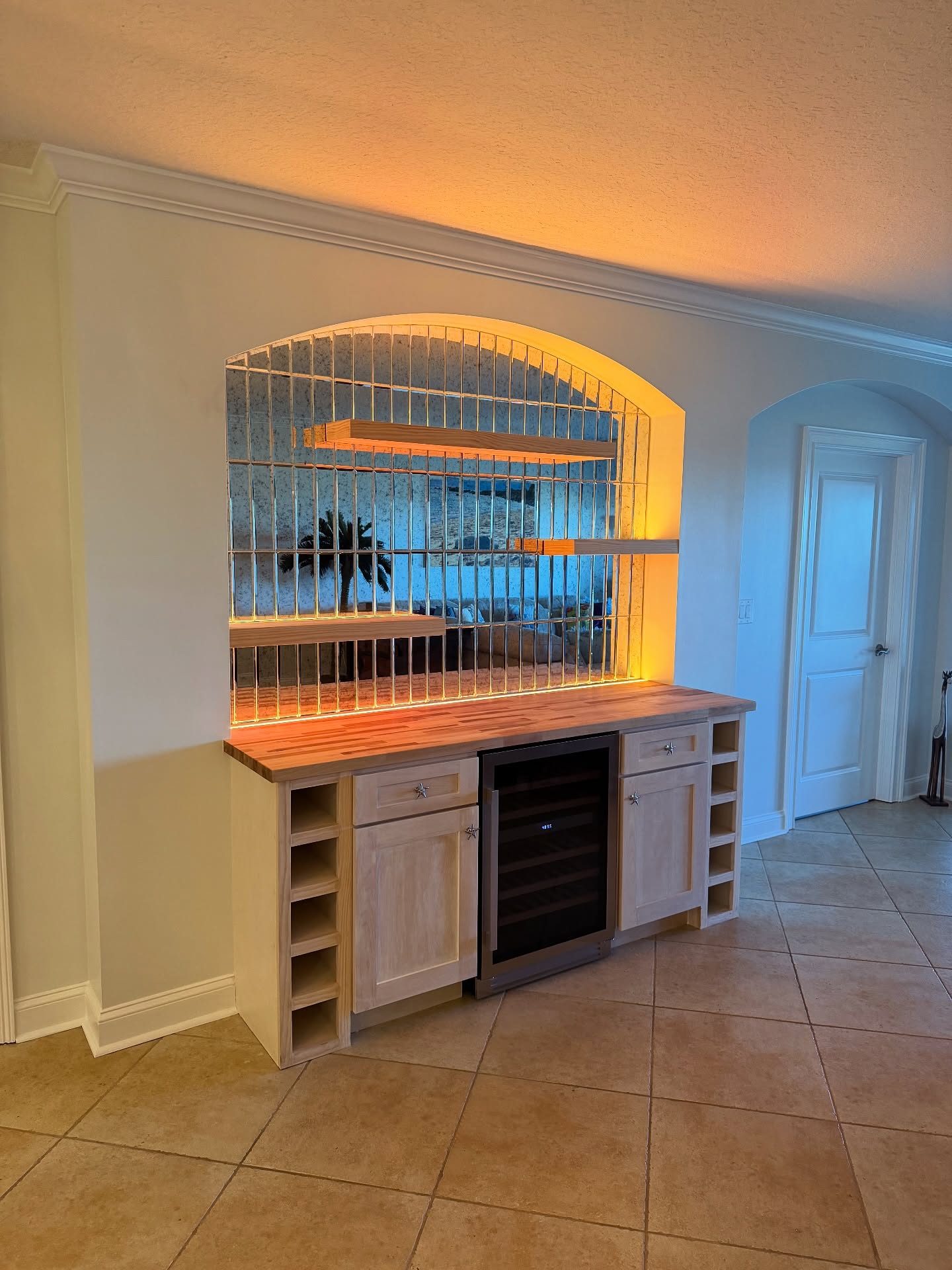 Floor-to-ceiling dry bar millwork, custom-built for the space, by AVP Construction JAX in Jacksonville & St. Johns County, FL