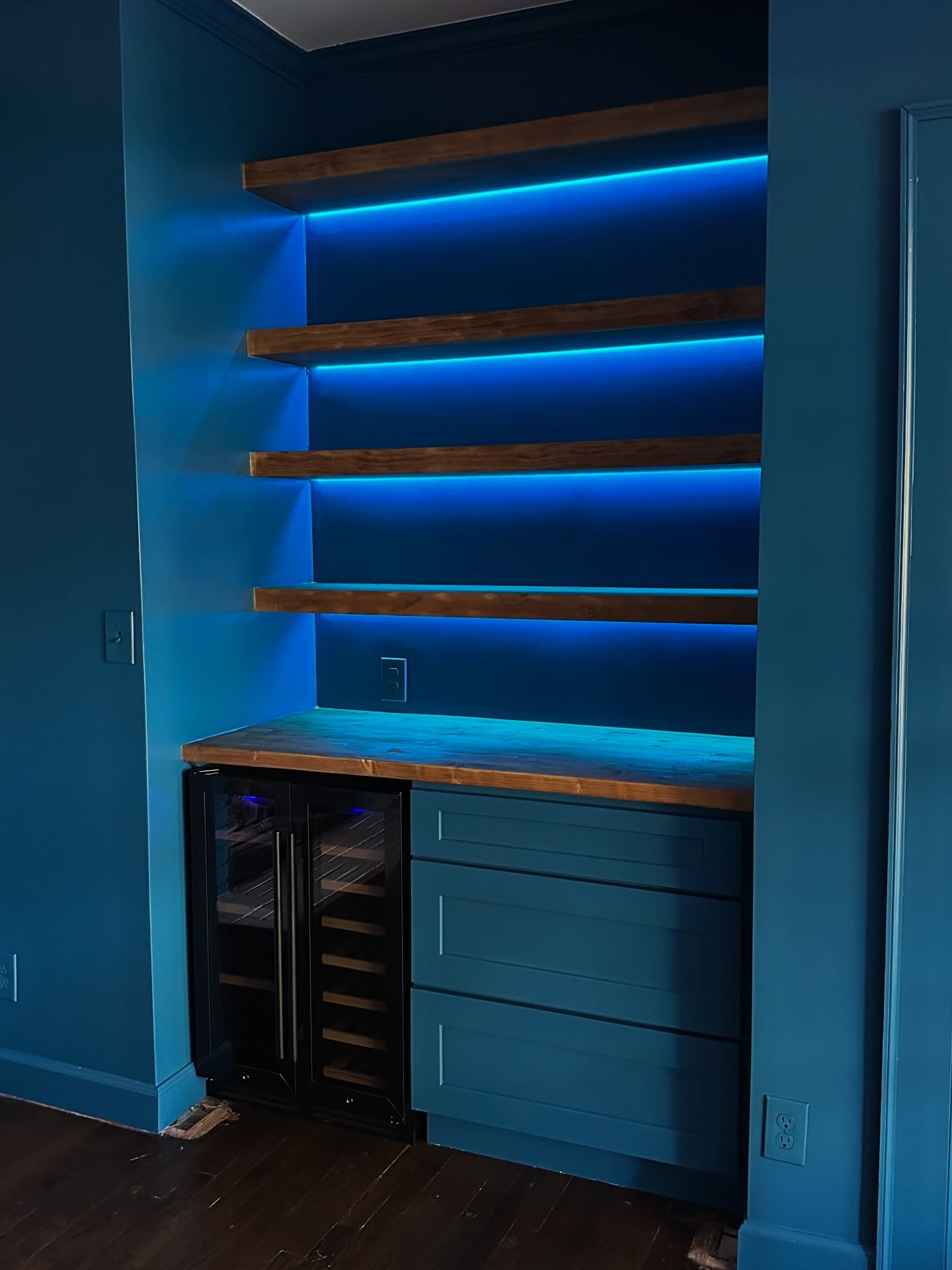 Wet-area-style dry bar with custom cabinetry, custom-built for the space, by AVP Construction JAX in Jacksonville & St. Johns County, FL