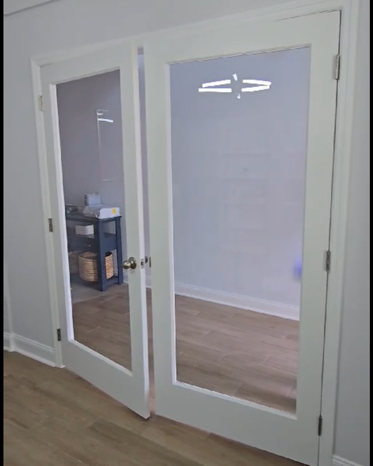 Pantry French doors with custom trim, custom-built for the space, by AVP Construction JAX in Jacksonville & St. Johns County, FL