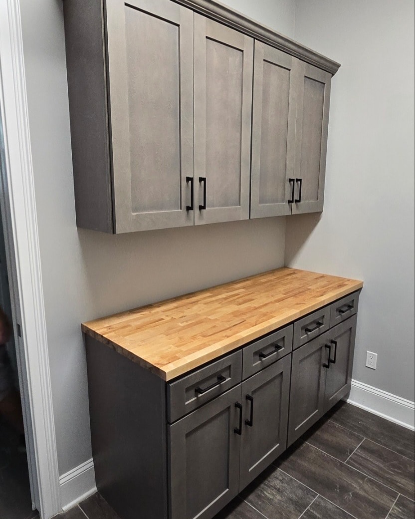 Laundry room custom cabinetry, custom-built for the space, by AVP Construction JAX in Jacksonville & St. Johns County, FL