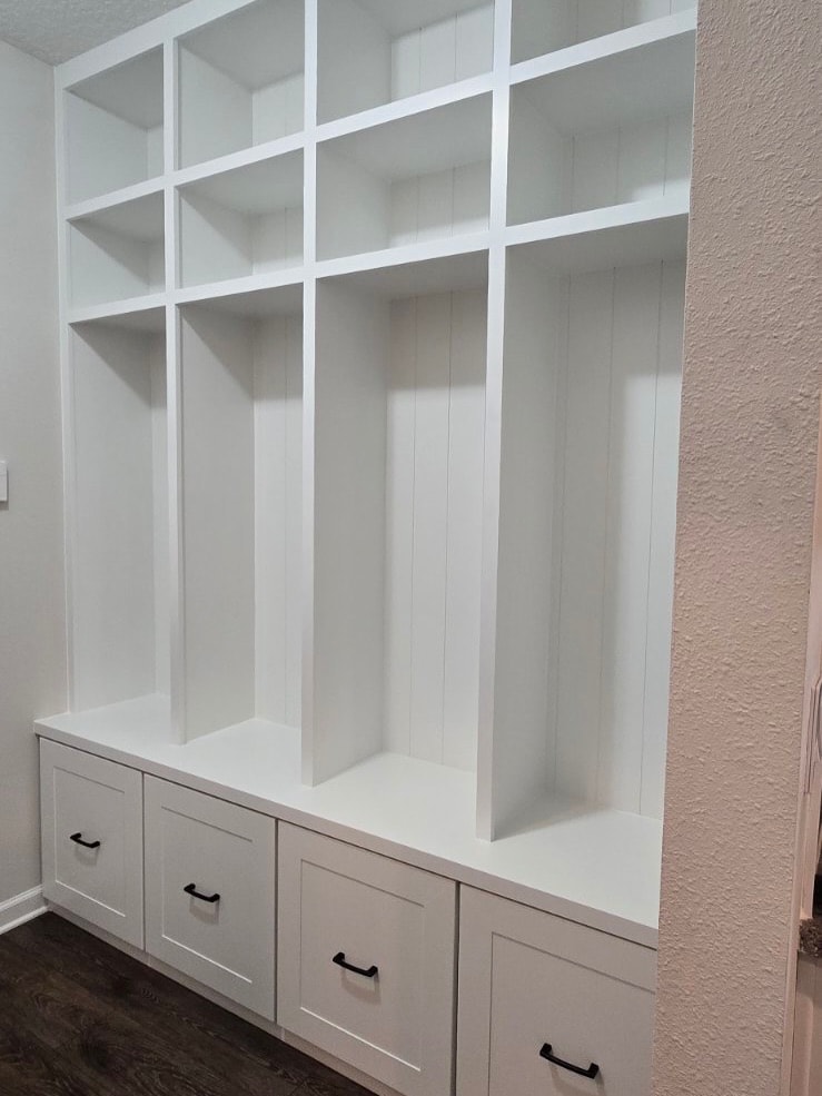 Built-in laundry room with folding counter, custom-built for the space, by AVP Construction JAX in Jacksonville & St. Johns County, FL