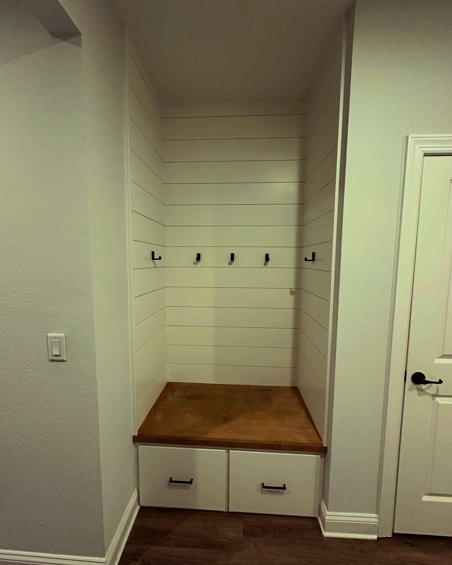 Mudroom drop zone with bench seating, custom-built for the space, by AVP Construction JAX in Jacksonville & St. Johns County, FL