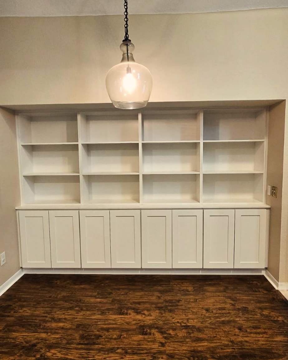 Floor-to-ceiling office bookcase, custom-built for the space, by AVP Construction JAX in Jacksonville & St. Johns County, FL