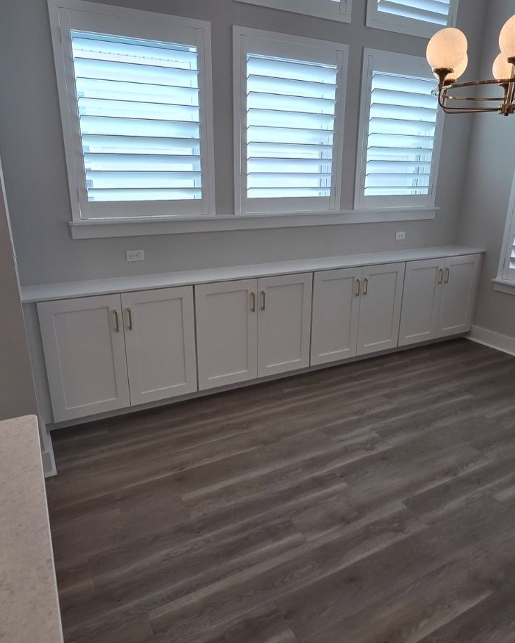 Built-in office workstation with cabinetry, custom-built for the space, by AVP Construction JAX in Jacksonville & St. Johns County, FL