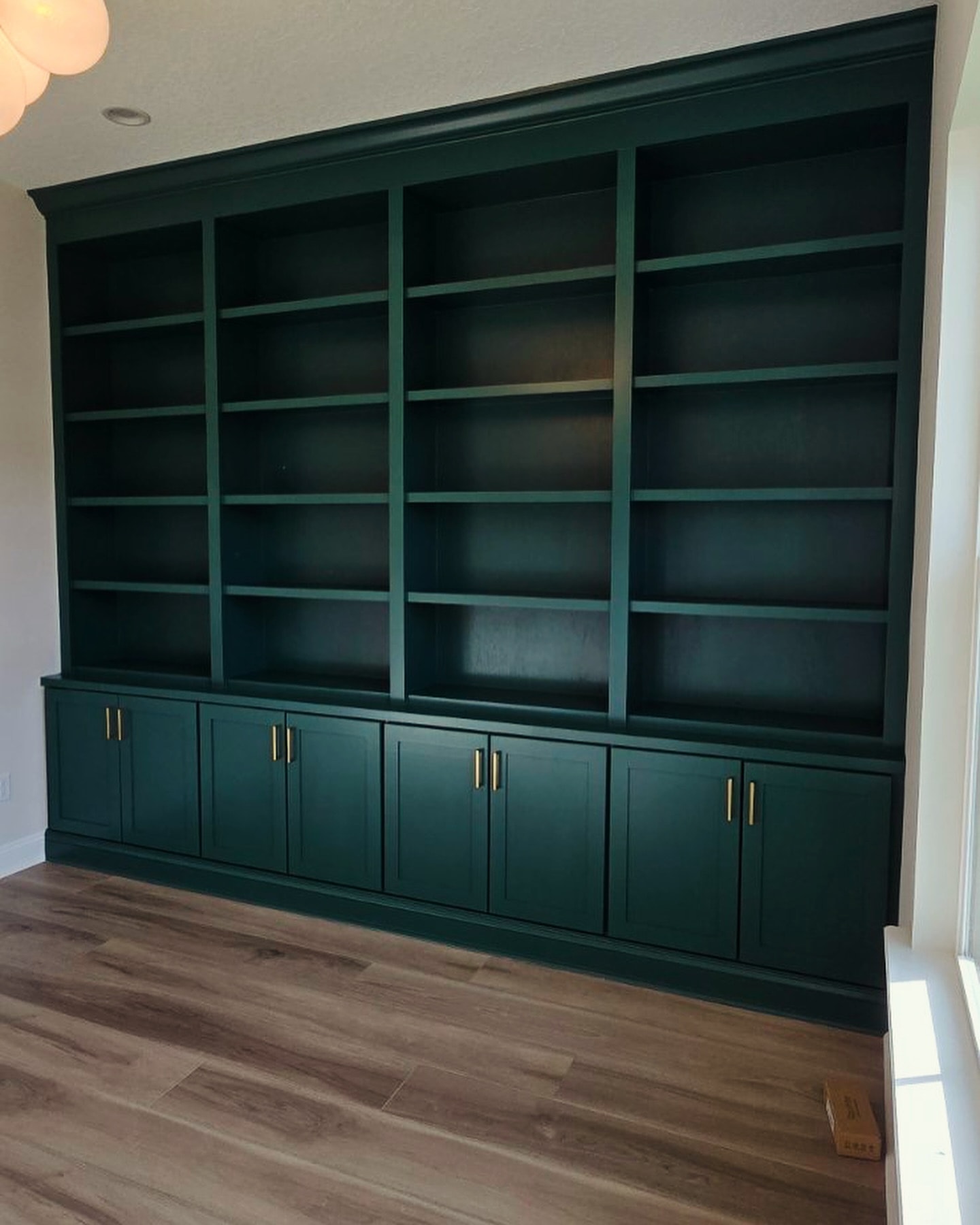 Home office wall of shelves and drawers, custom-built for the space, by AVP Construction JAX in Jacksonville & St. Johns County, FL