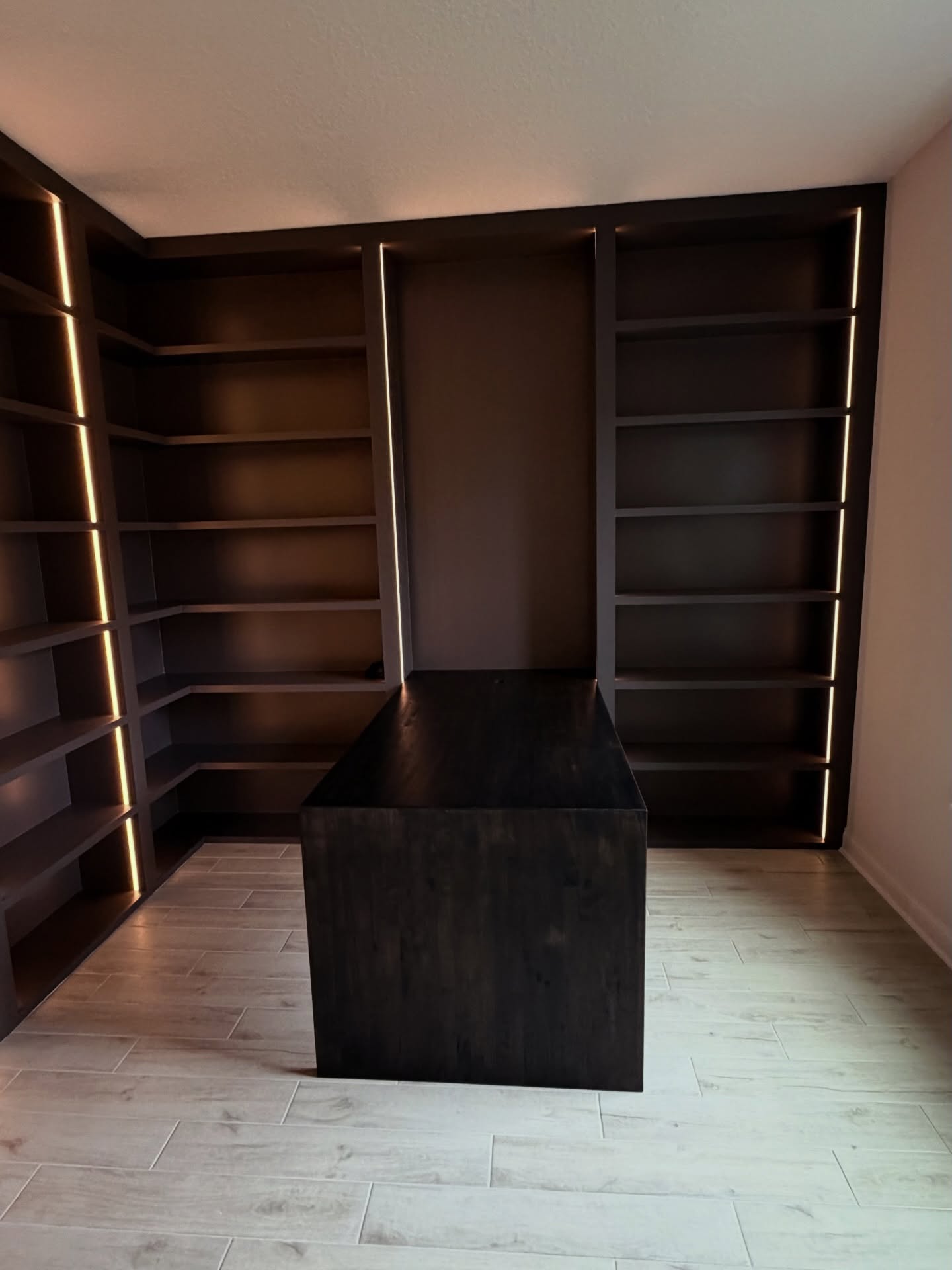 Custom home office built-in desk and shelving, custom-built for the space, by AVP Construction JAX in Jacksonville & St. Johns County, FL