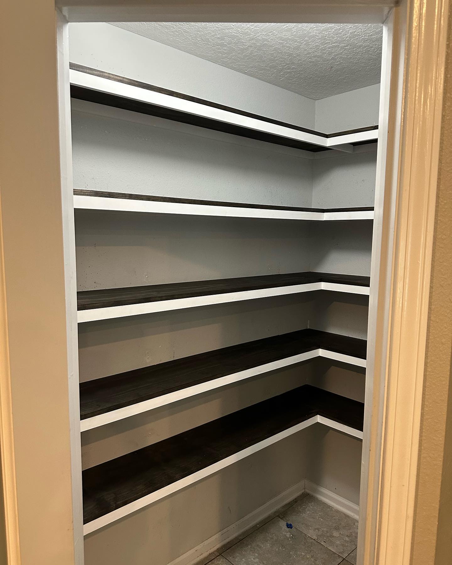 Walk-in pantry with shaker cabinetry, custom-built for the space, by AVP Construction JAX in Jacksonville & St. Johns County, FL