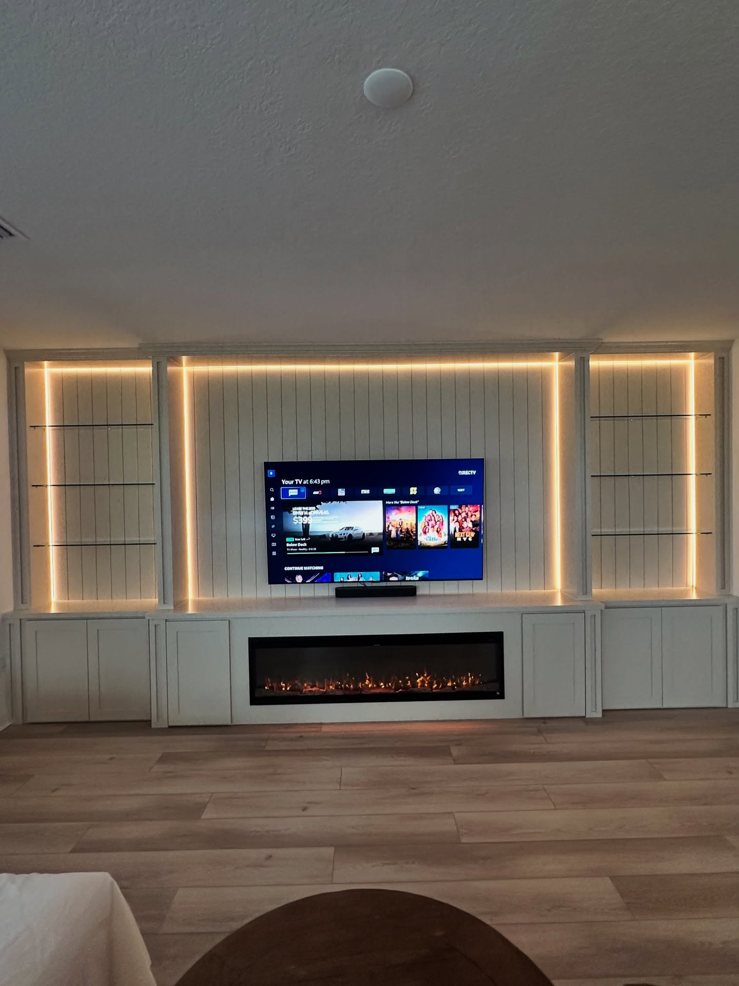 Custom TV entertainment center built-in, custom-built for the space, by AVP Construction JAX in Jacksonville & St. Johns County, FL