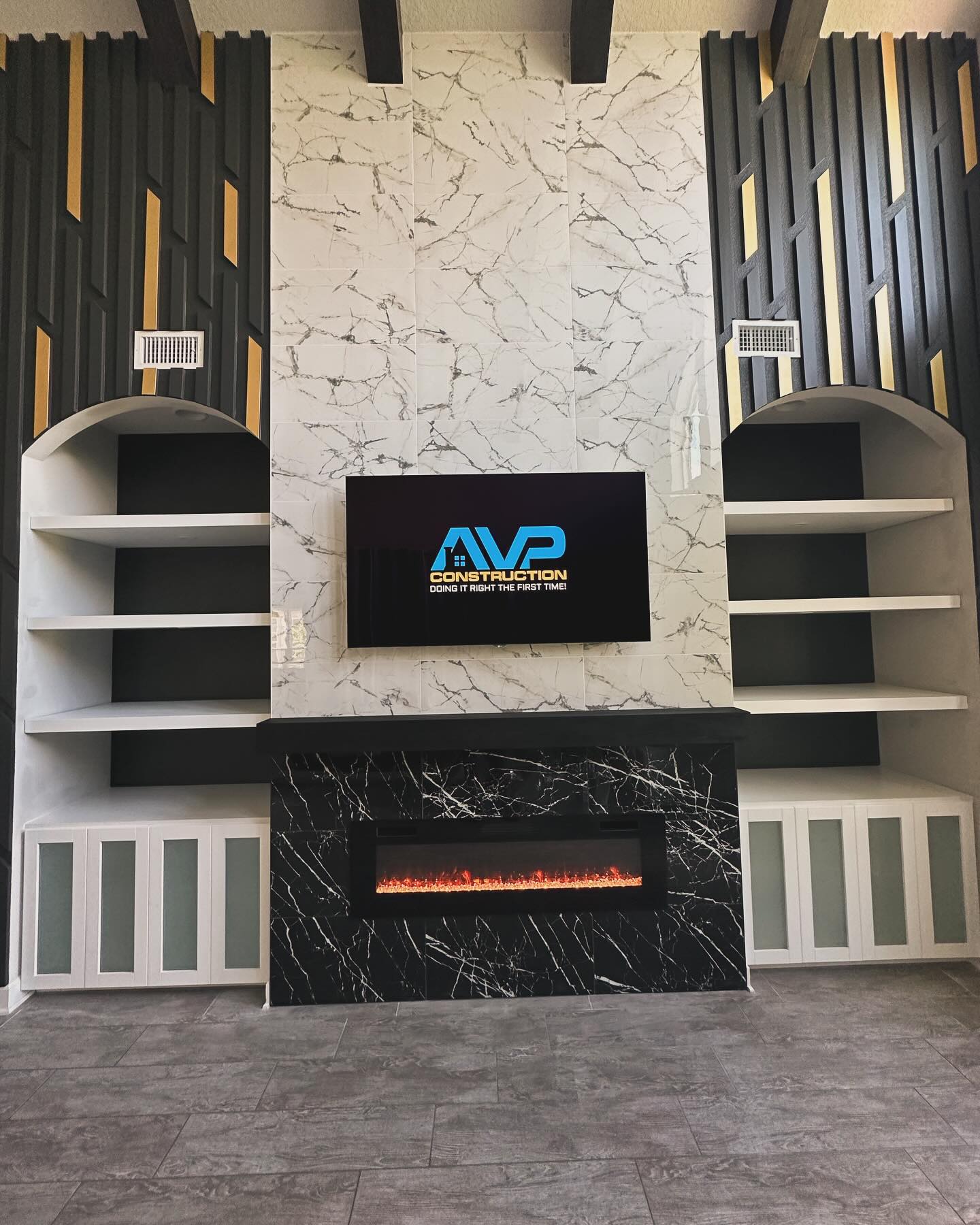 Floating-shelf TV built-in with shaker cabinets, custom-built for the space, by AVP Construction JAX in Jacksonville & St. Johns County, FL