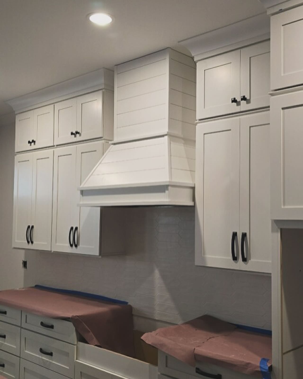 Shaker-style custom range hood, custom-built for the space, by AVP Construction JAX in Jacksonville & St. Johns County, FL