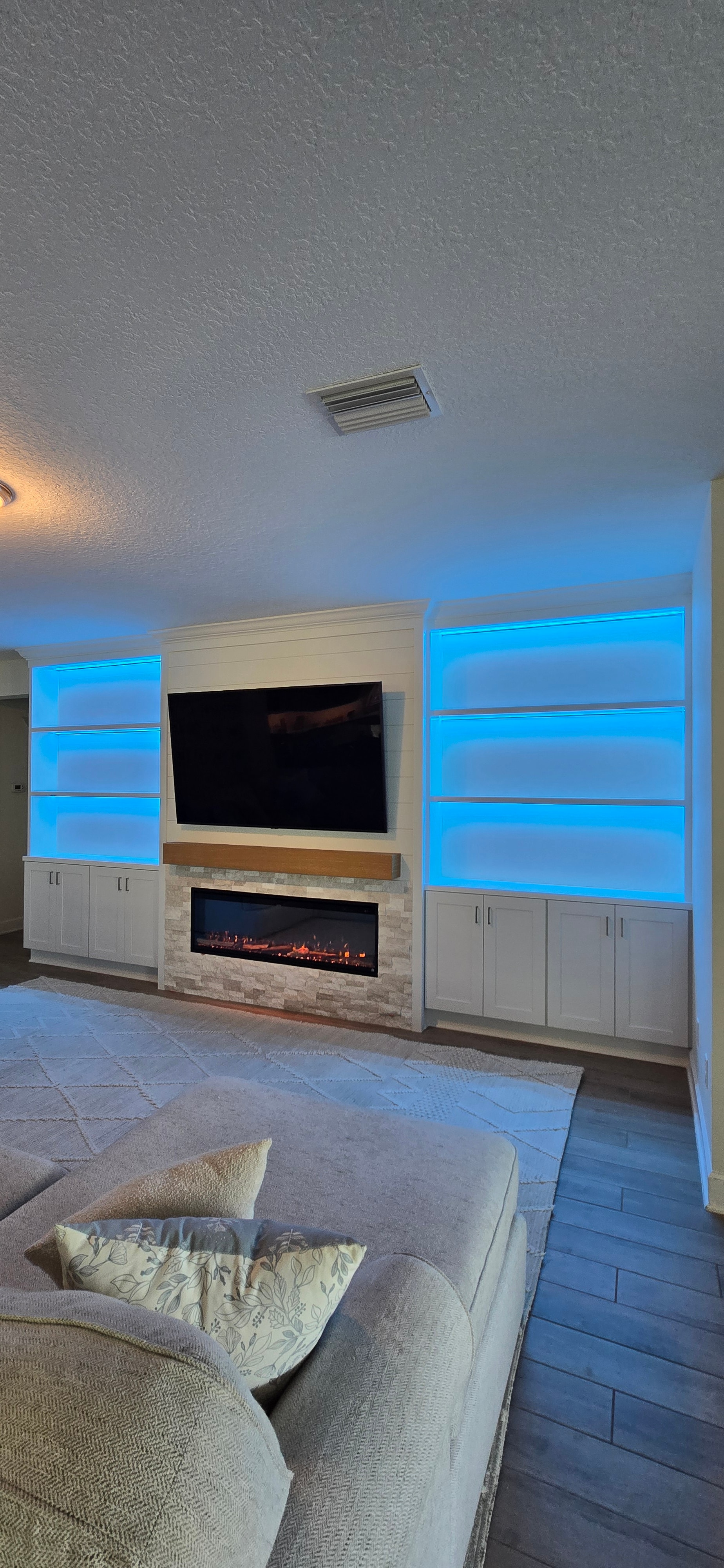 Custom Full-Wall Entertainment Center with Electric Fireplace & LED Shelves in Shearwater, Jacksonville FL in Shearwater, Jacksonville, FL