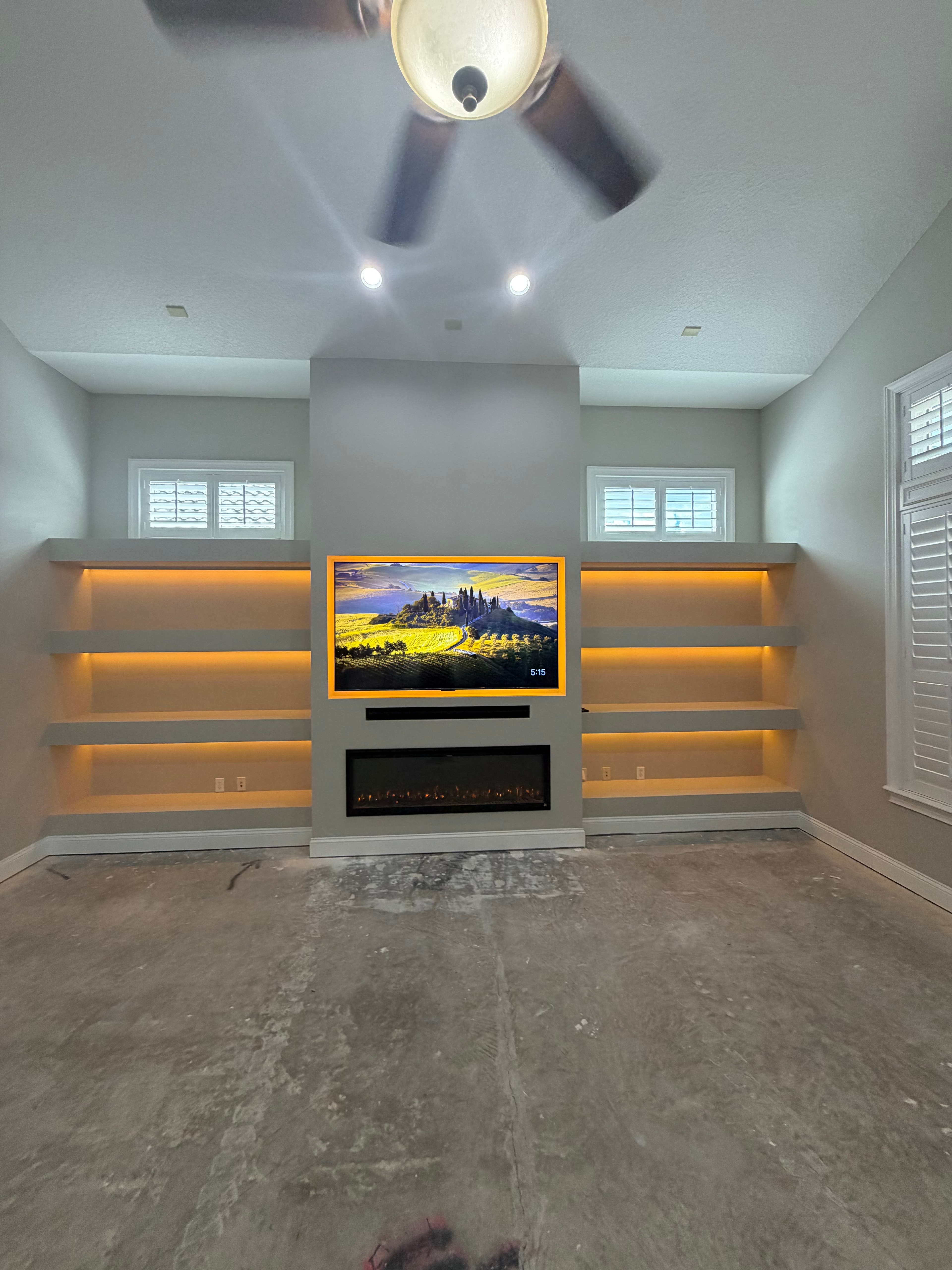 Custom TV Entertainment Center with Electric Fireplace & Floating Shelves in Julington Creek, St. Johns FL in Julington Creek , St. Johns, FL