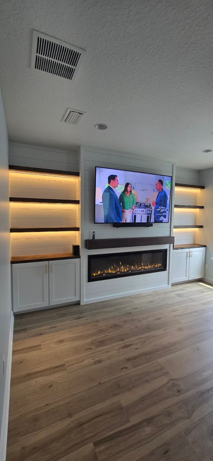 Custom TV Entertainment Center with Shiplap & Floating Shelves in RiverTown, Fruit Cove FL — RiverTown, Fruit Cove, FL