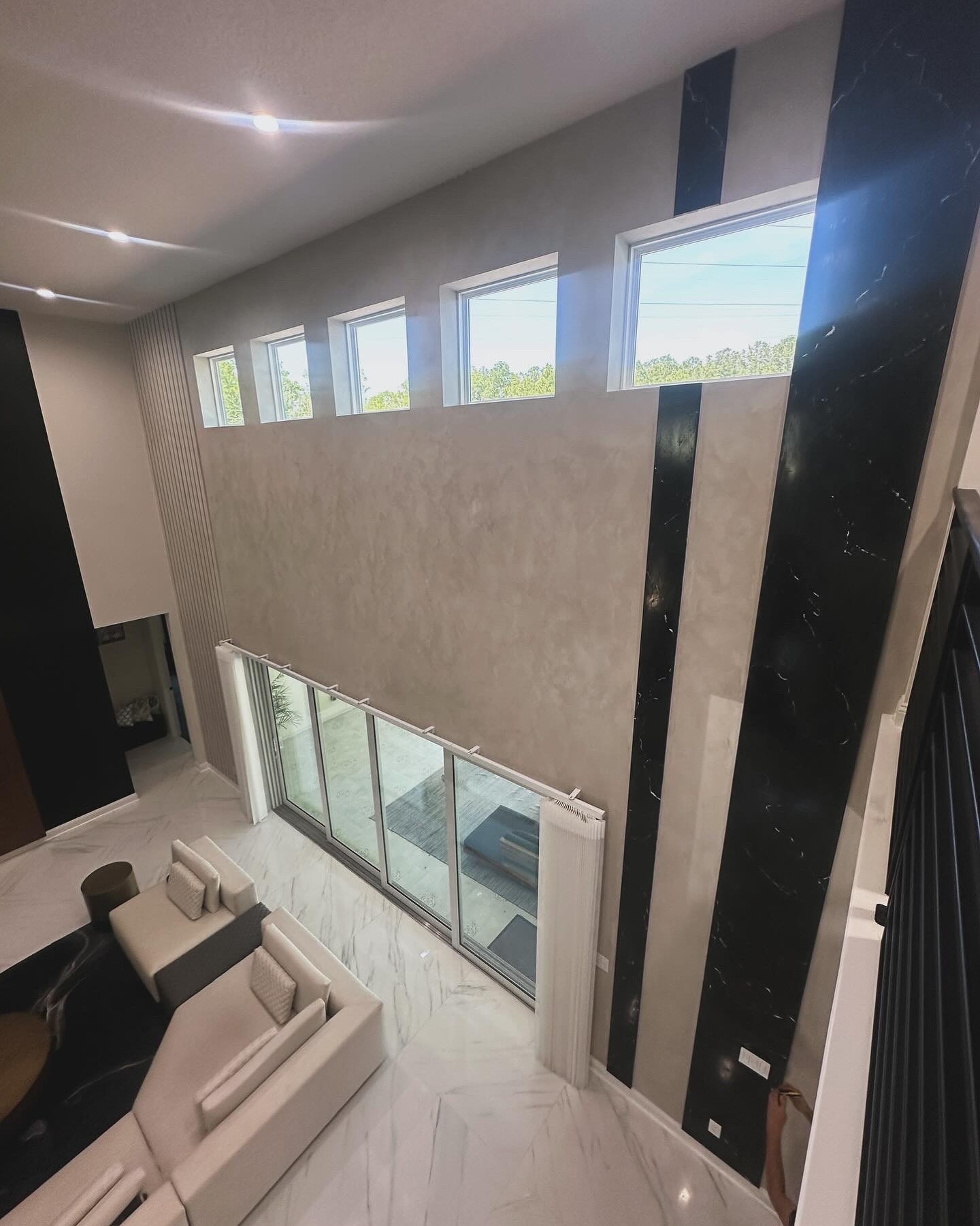 Modern fluted wood accent wall by AVP Construction JAX — Jacksonville & St. John's County, FL