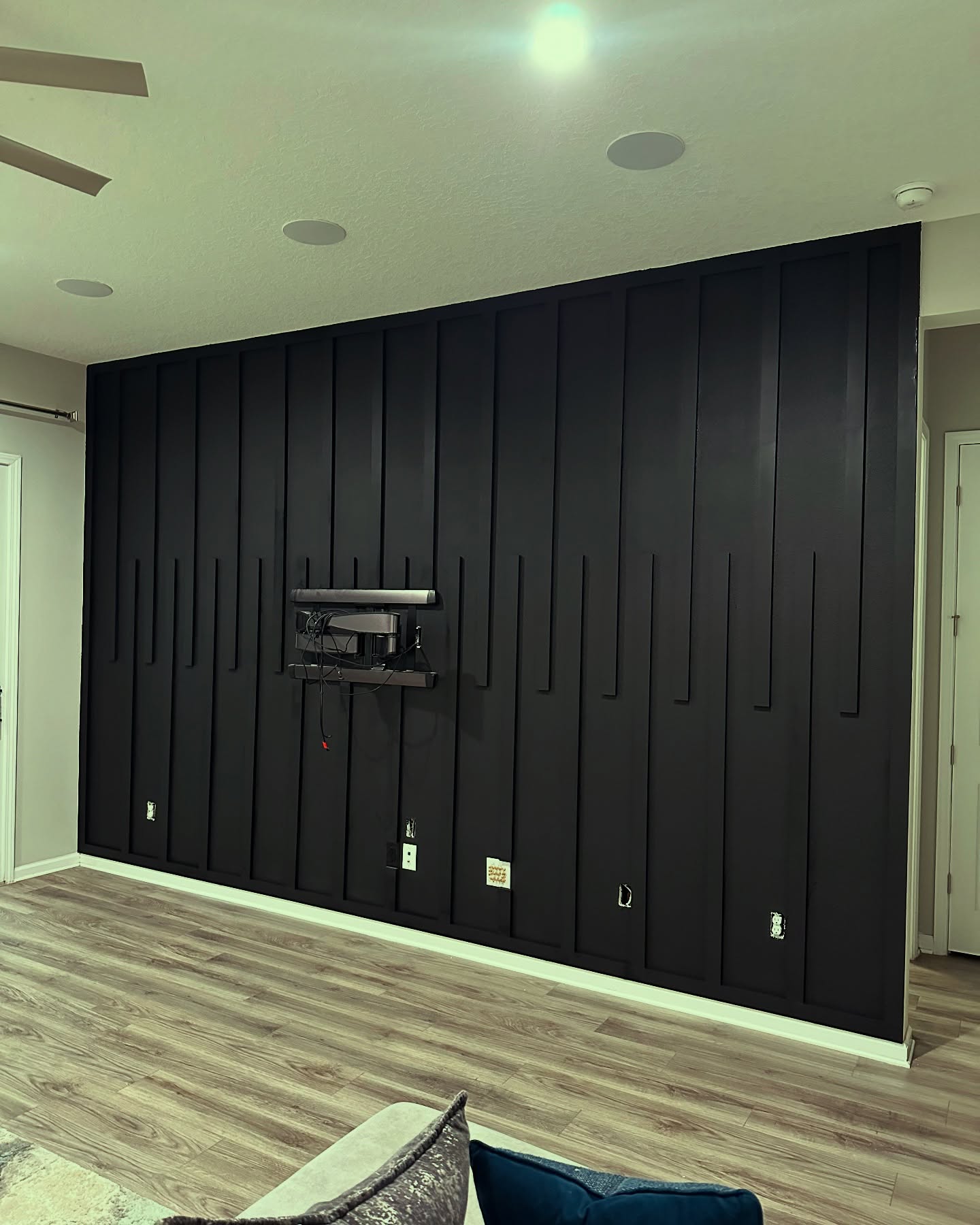 Vertical slat wood accent wall by AVP Construction JAX — Jacksonville & St. John's County, FL