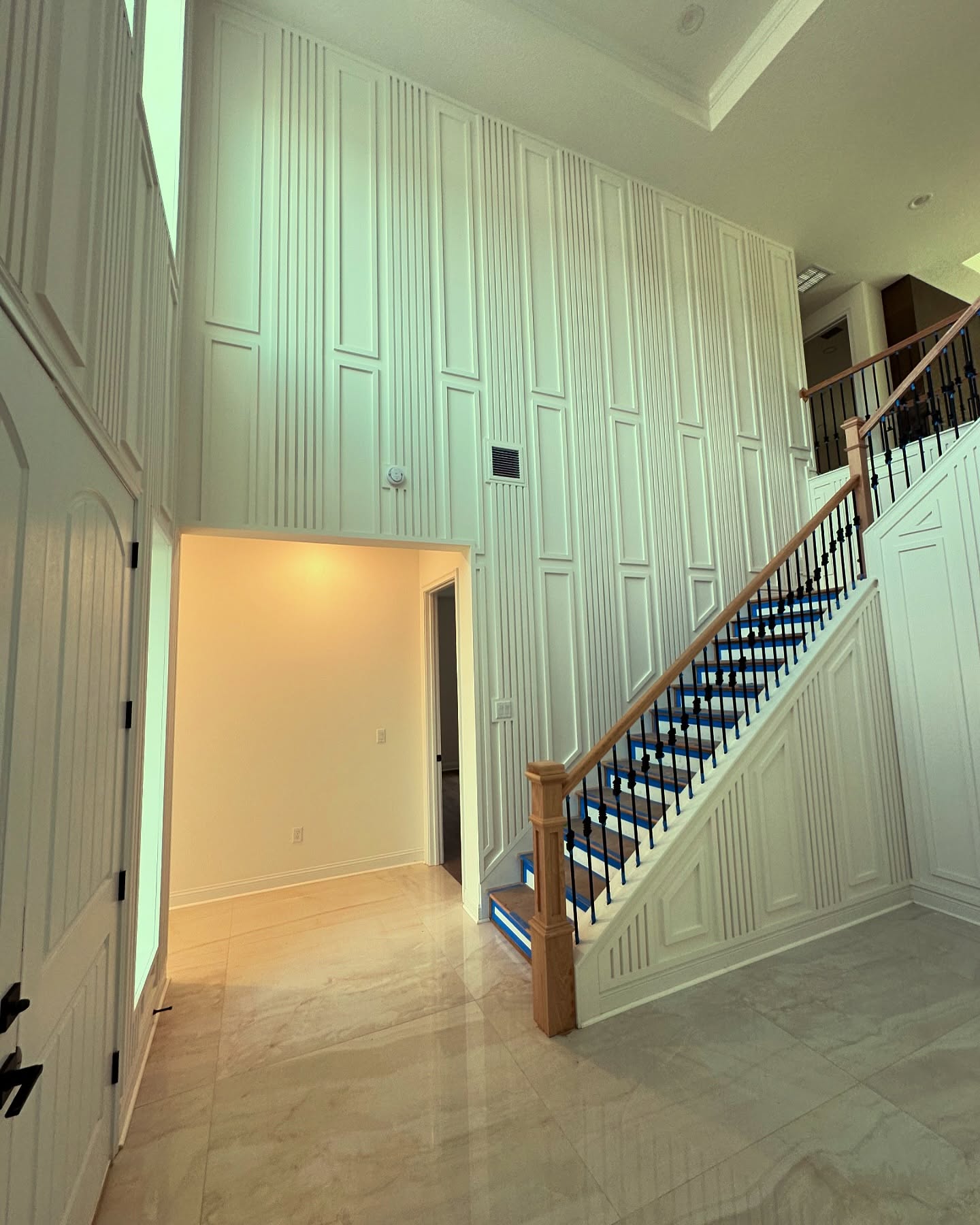 Modern fluted wood accent wall by AVP Construction JAX — Jacksonville & St. John's County, FL