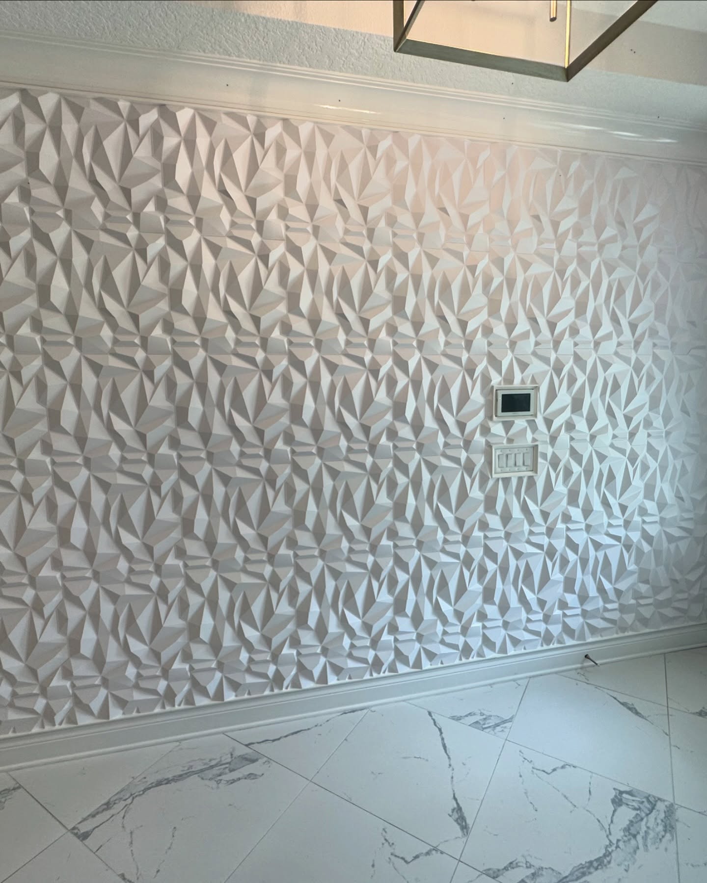 Floor-to-ceiling slat accent wall by AVP Construction JAX — Jacksonville & St. John's County, FL