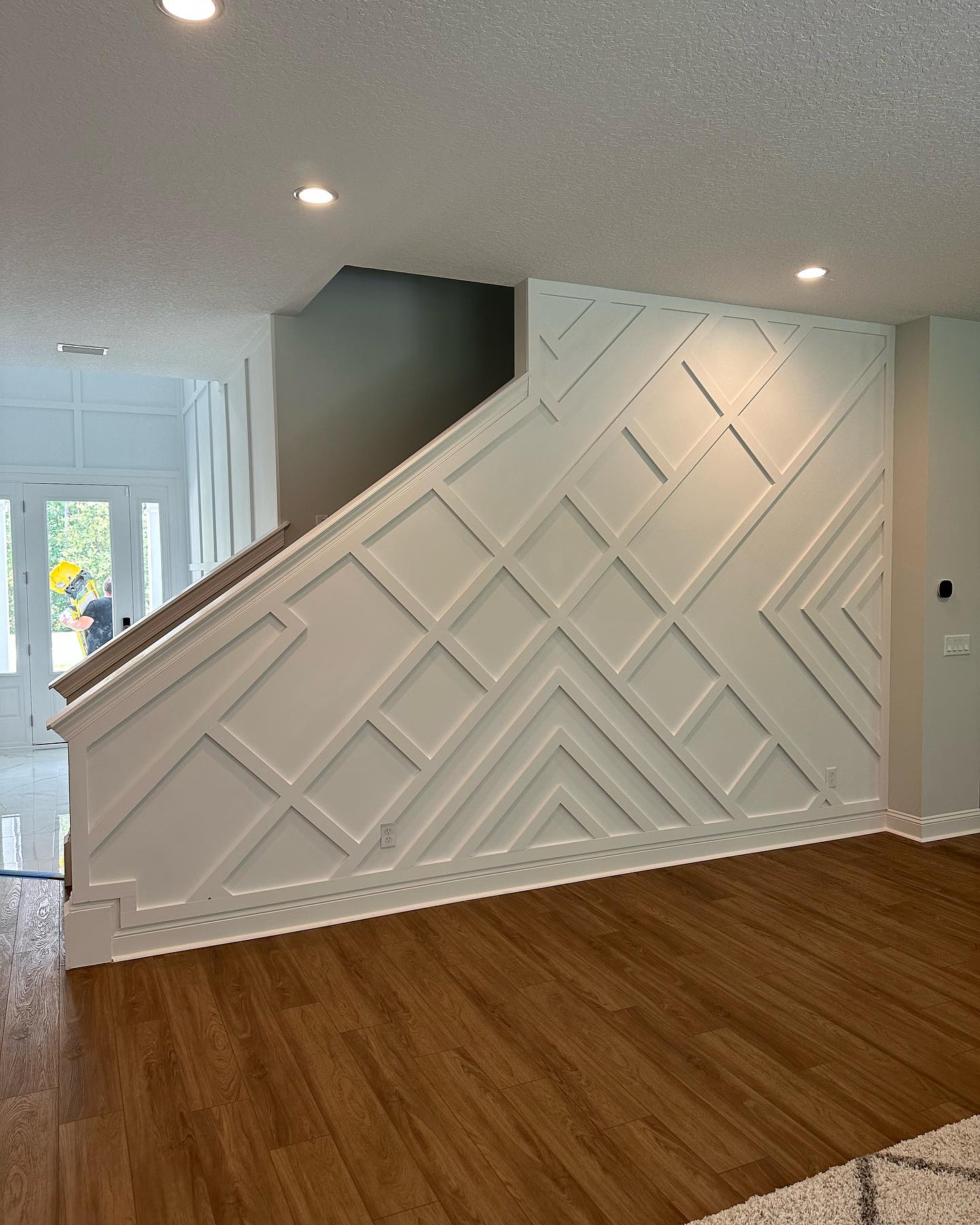 Wainscoting feature wall with chair rail by AVP Construction JAX — Jacksonville & St. John's County, FL