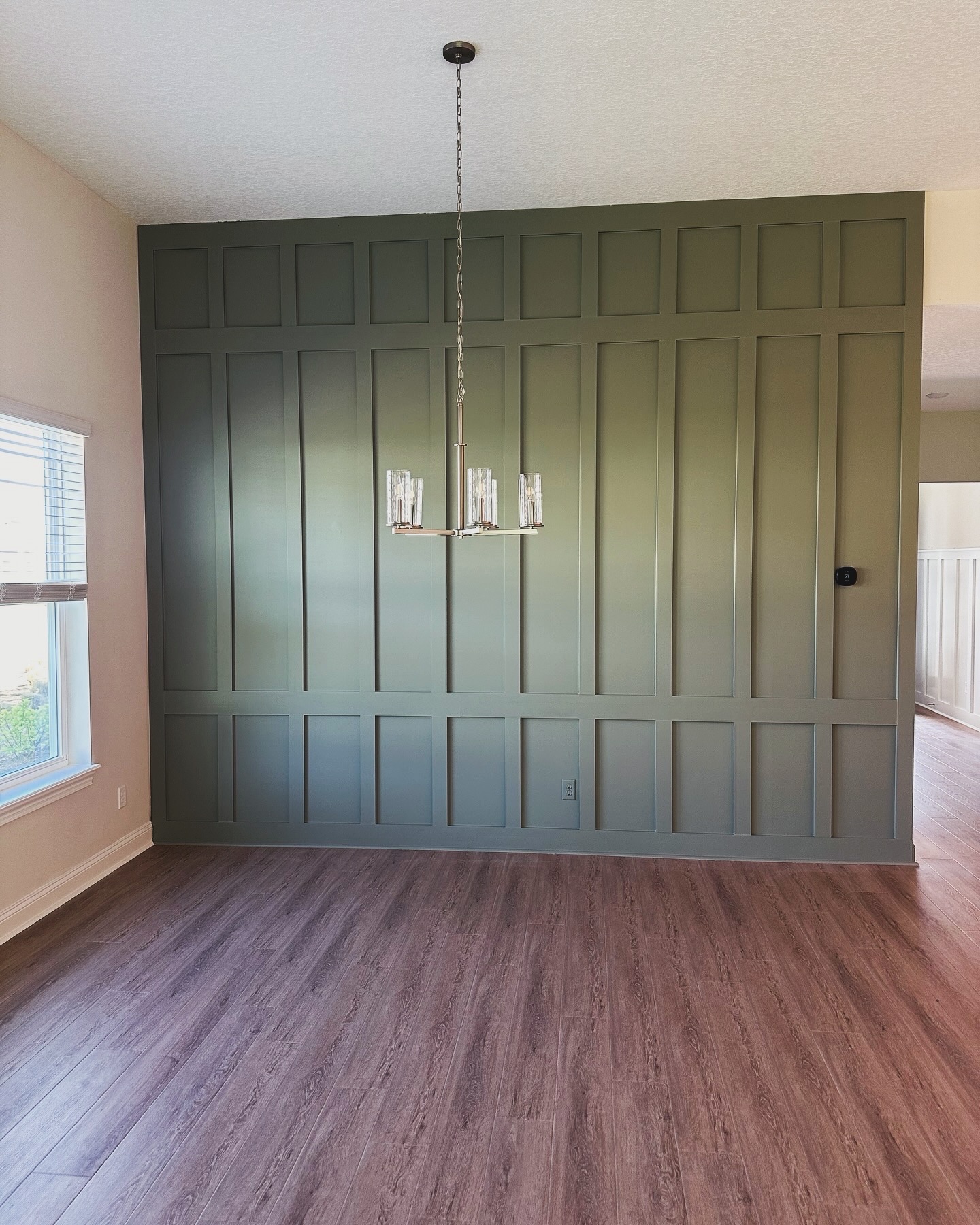 Floor-to-ceiling slat accent wall by AVP Construction JAX — Jacksonville & St. John's County, FL