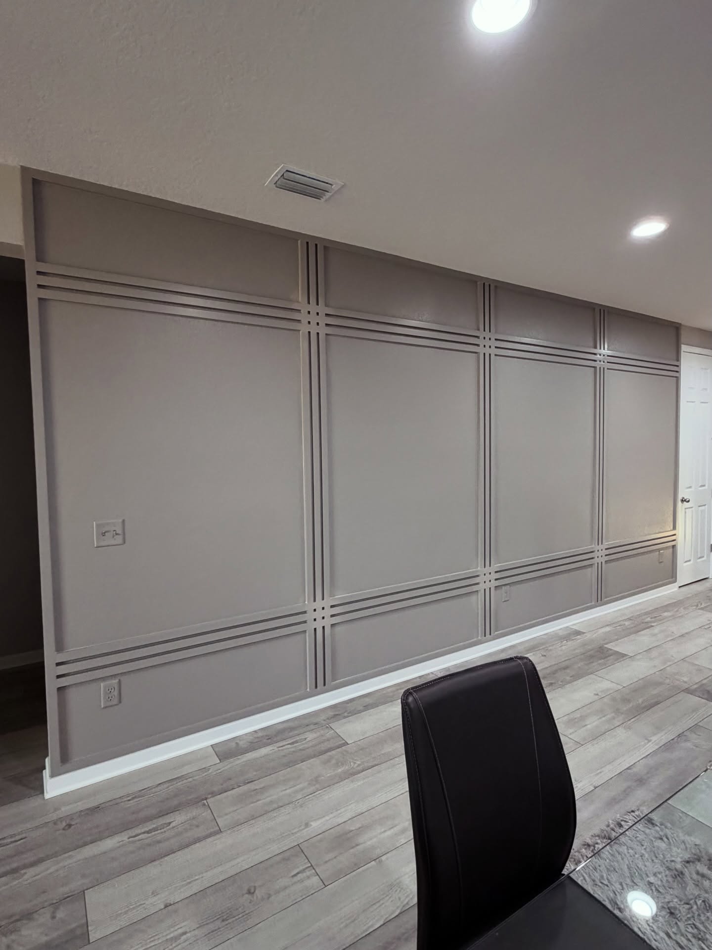 Vertical slat wood accent wall by AVP Construction JAX — Jacksonville & St. John's County, FL