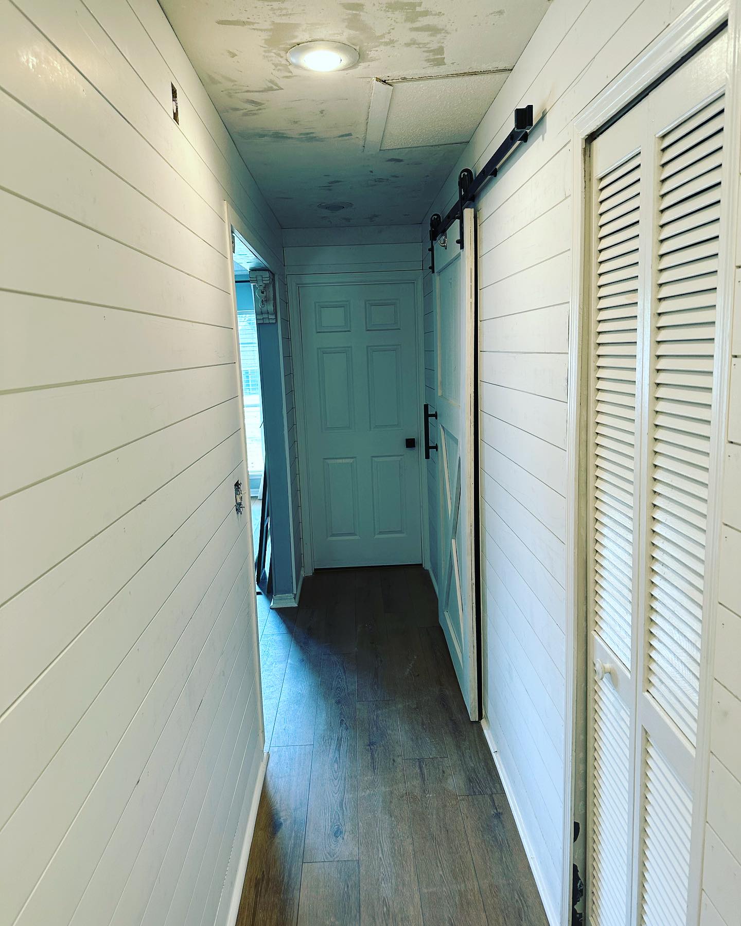 Vertical slat wood accent wall by AVP Construction JAX — Jacksonville & St. John's County, FL