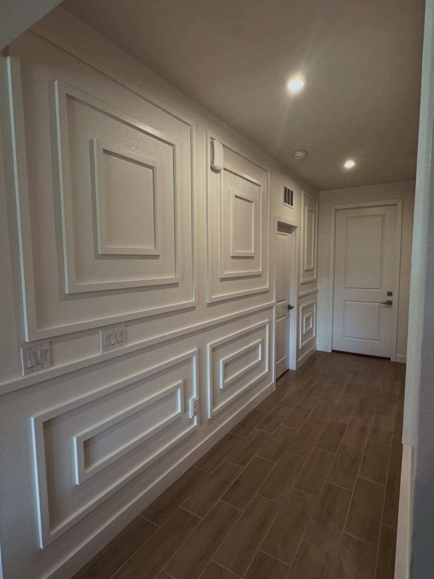 Modern fluted wood accent wall by AVP Construction JAX — Jacksonville & St. John's County, FL