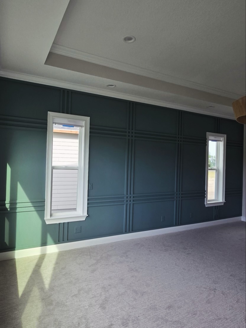 Floor-to-ceiling slat accent wall by AVP Construction JAX — Jacksonville & St. John's County, FL