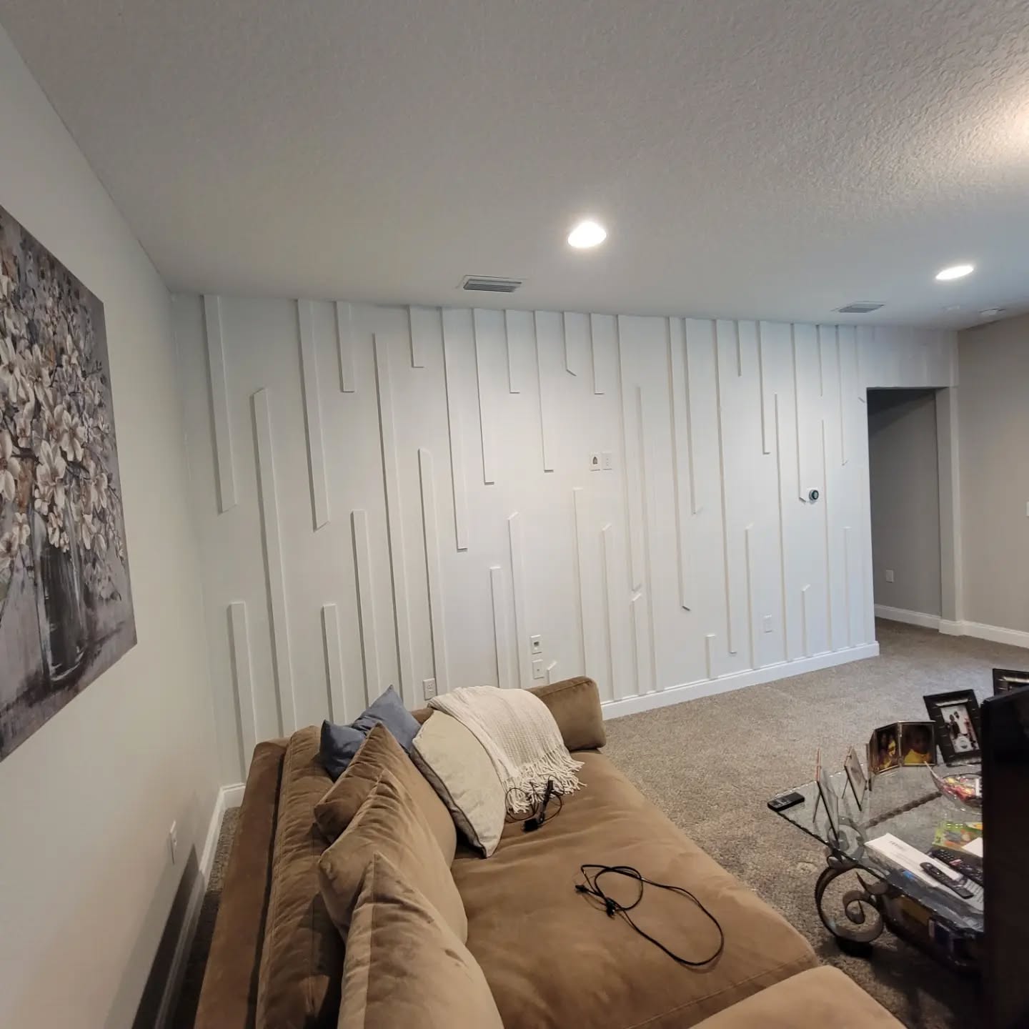 Modern fluted wood accent wall by AVP Construction JAX — Jacksonville & St. John's County, FL
