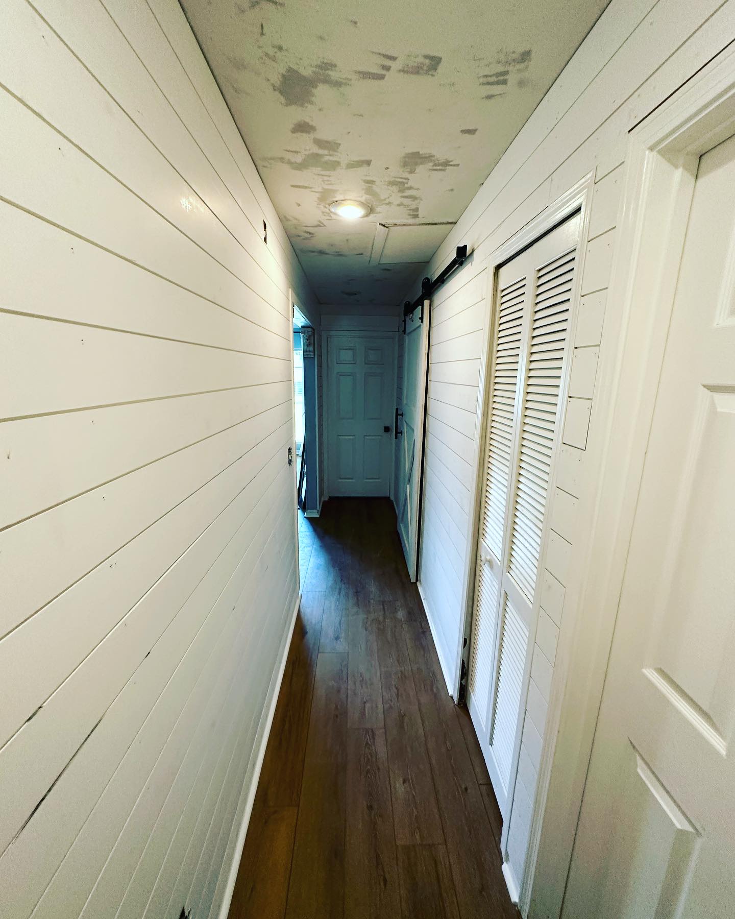Painted shiplap feature wall by AVP Construction JAX — Jacksonville & St. John's County, FL