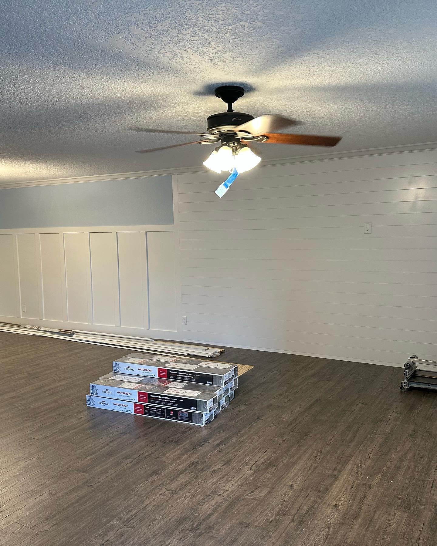 Floor-to-ceiling slat accent wall by AVP Construction JAX — Jacksonville & St. John's County, FL