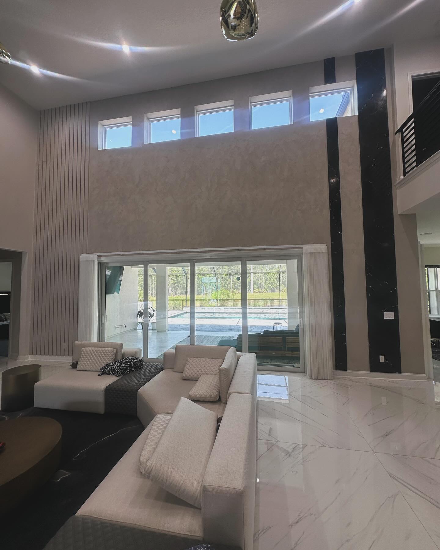 Modern fluted wood accent wall by AVP Construction JAX — Jacksonville & St. John's County, FL
