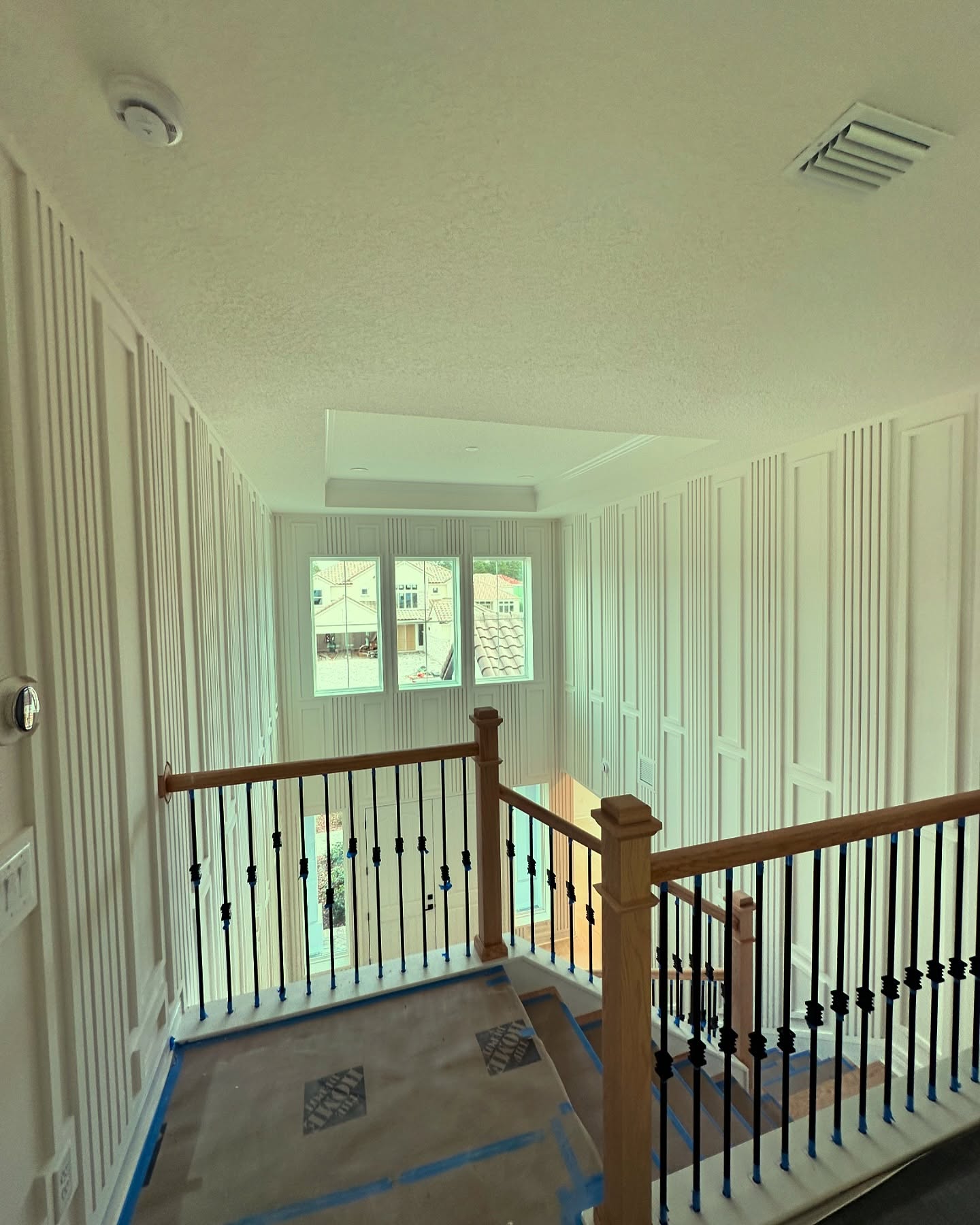 Wainscoting feature wall with chair rail by AVP Construction JAX — Jacksonville & St. John's County, FL