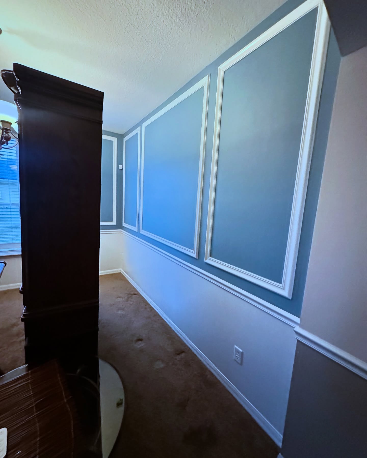 Vertical slat wood accent wall by AVP Construction JAX — Jacksonville & St. John's County, FL