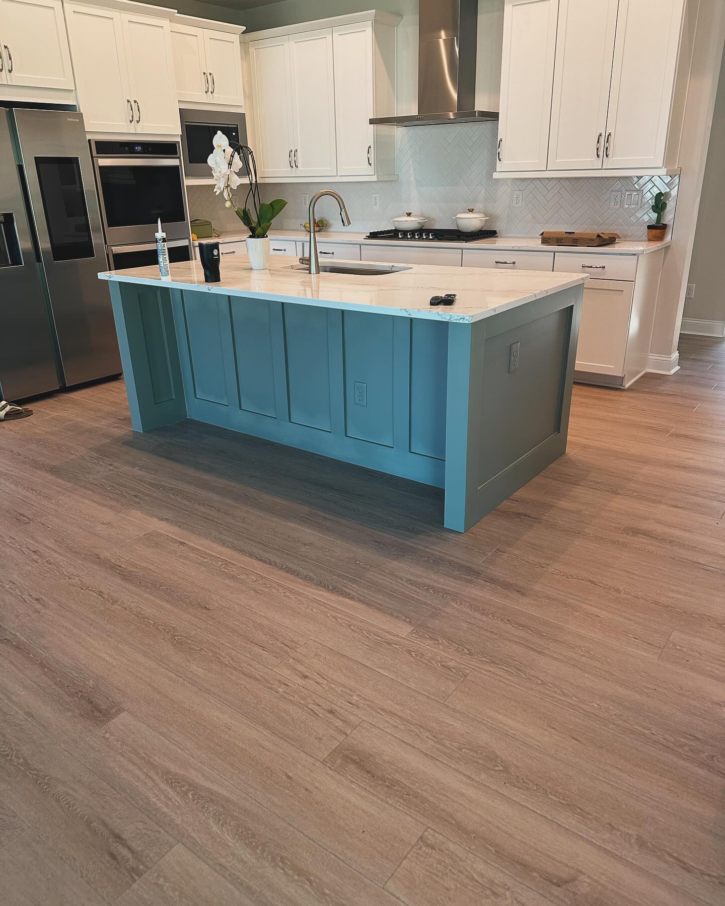 Floor-to-ceiling slat accent wall by AVP Construction JAX — Jacksonville & St. John's County, FL