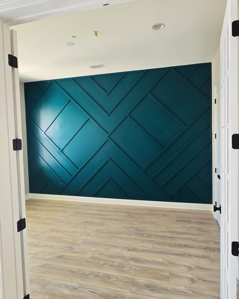 Floor-to-ceiling slat accent wall by AVP Construction JAX — Jacksonville & St. John's County, FL