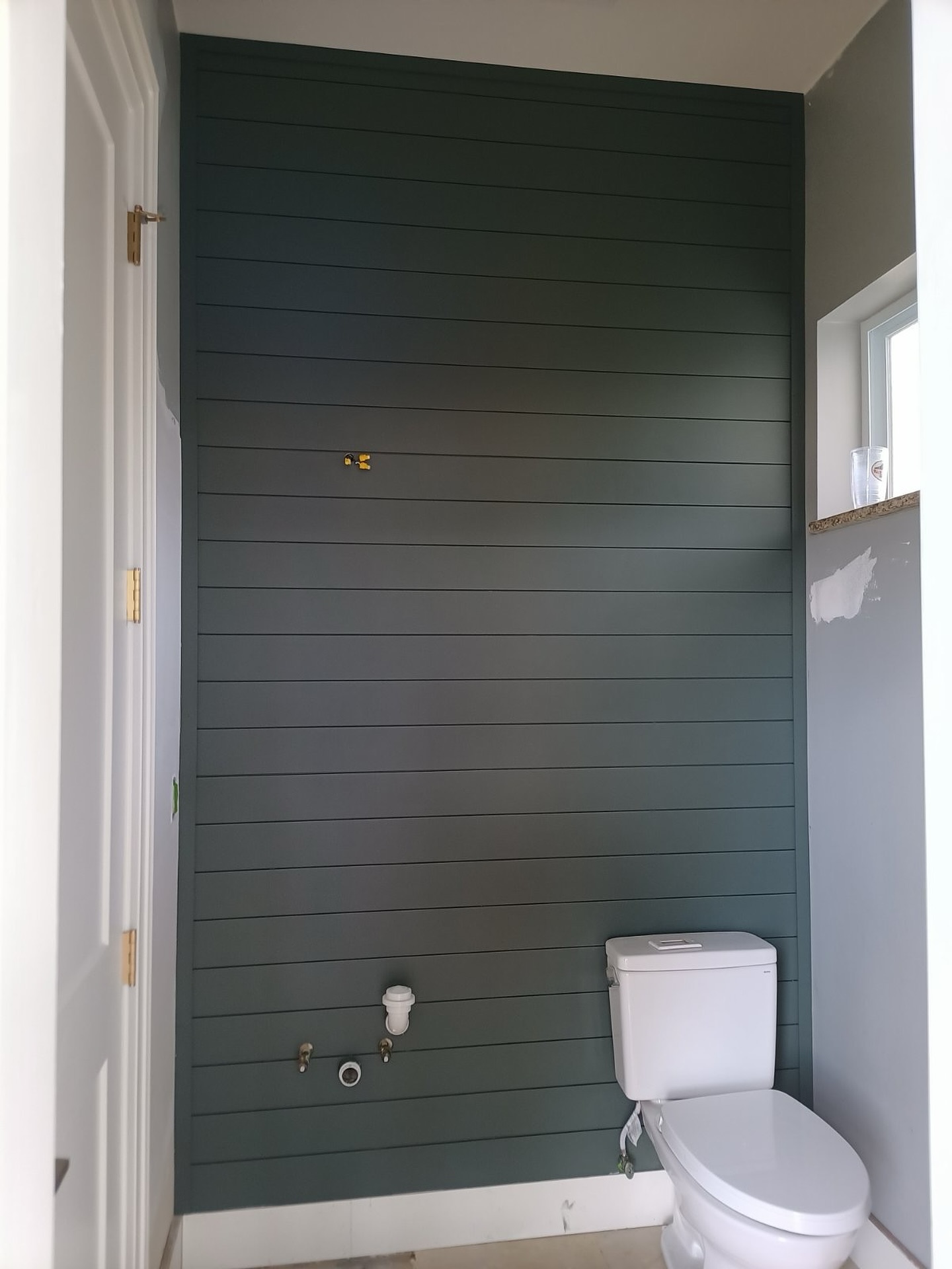 Modern fluted wood accent wall by AVP Construction JAX — Jacksonville & St. John's County, FL