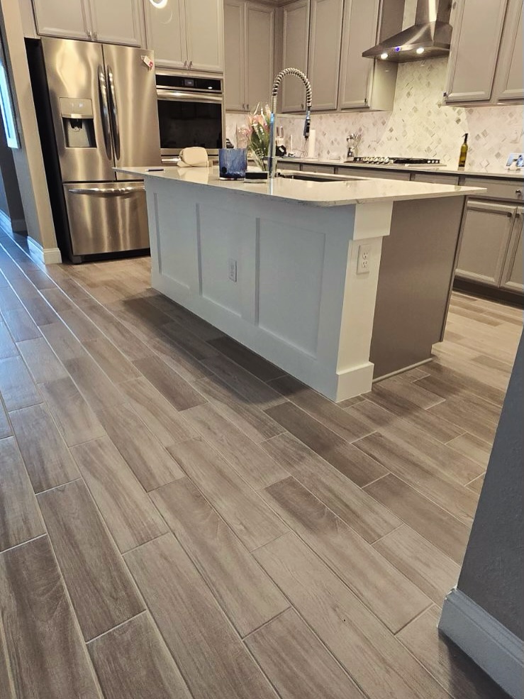 Floor-to-ceiling slat accent wall by AVP Construction JAX — Jacksonville & St. John's County, FL