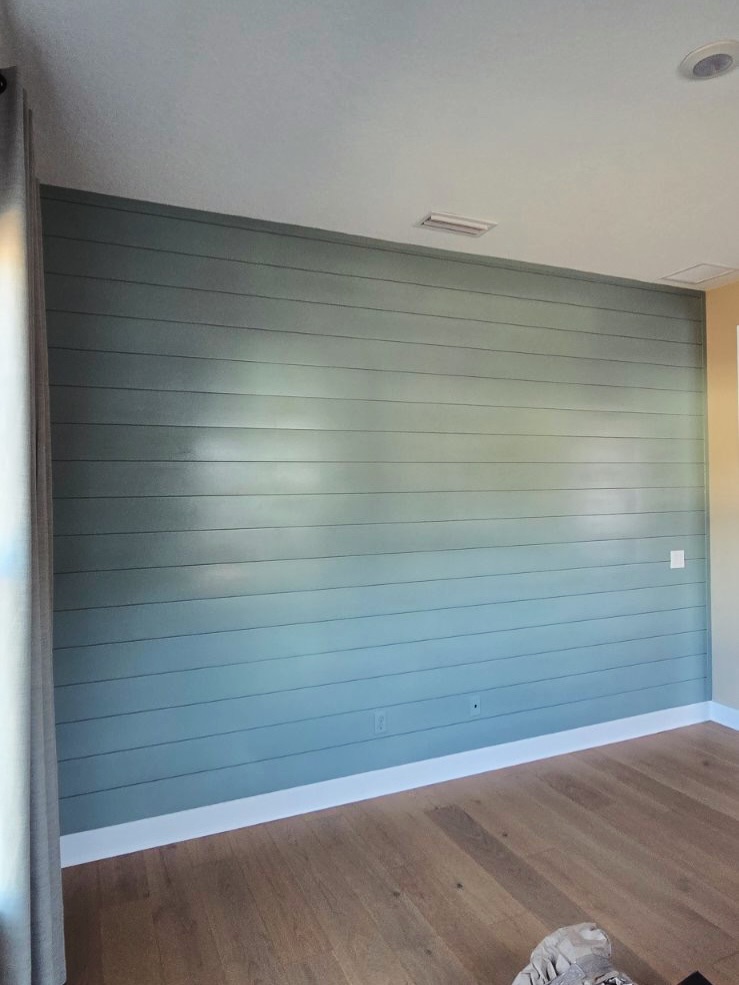Modern fluted wood accent wall by AVP Construction JAX — Jacksonville & St. John's County, FL