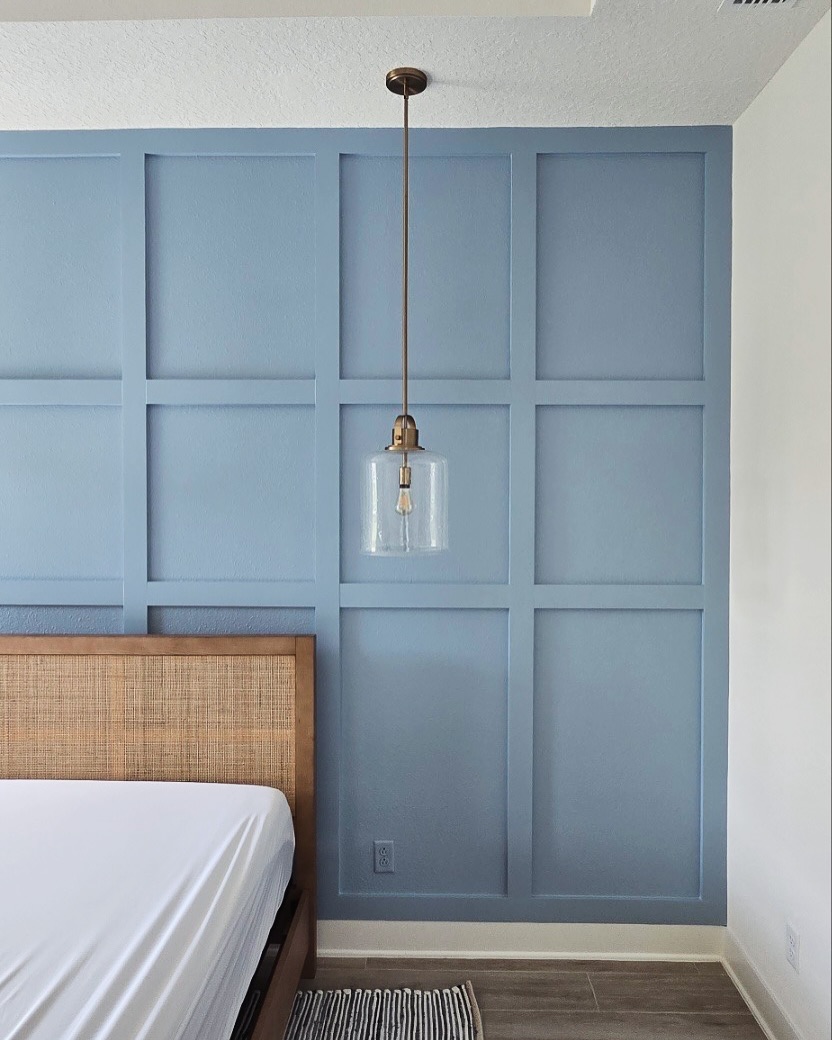 Floor-to-ceiling slat accent wall by AVP Construction JAX — Jacksonville & St. John's County, FL