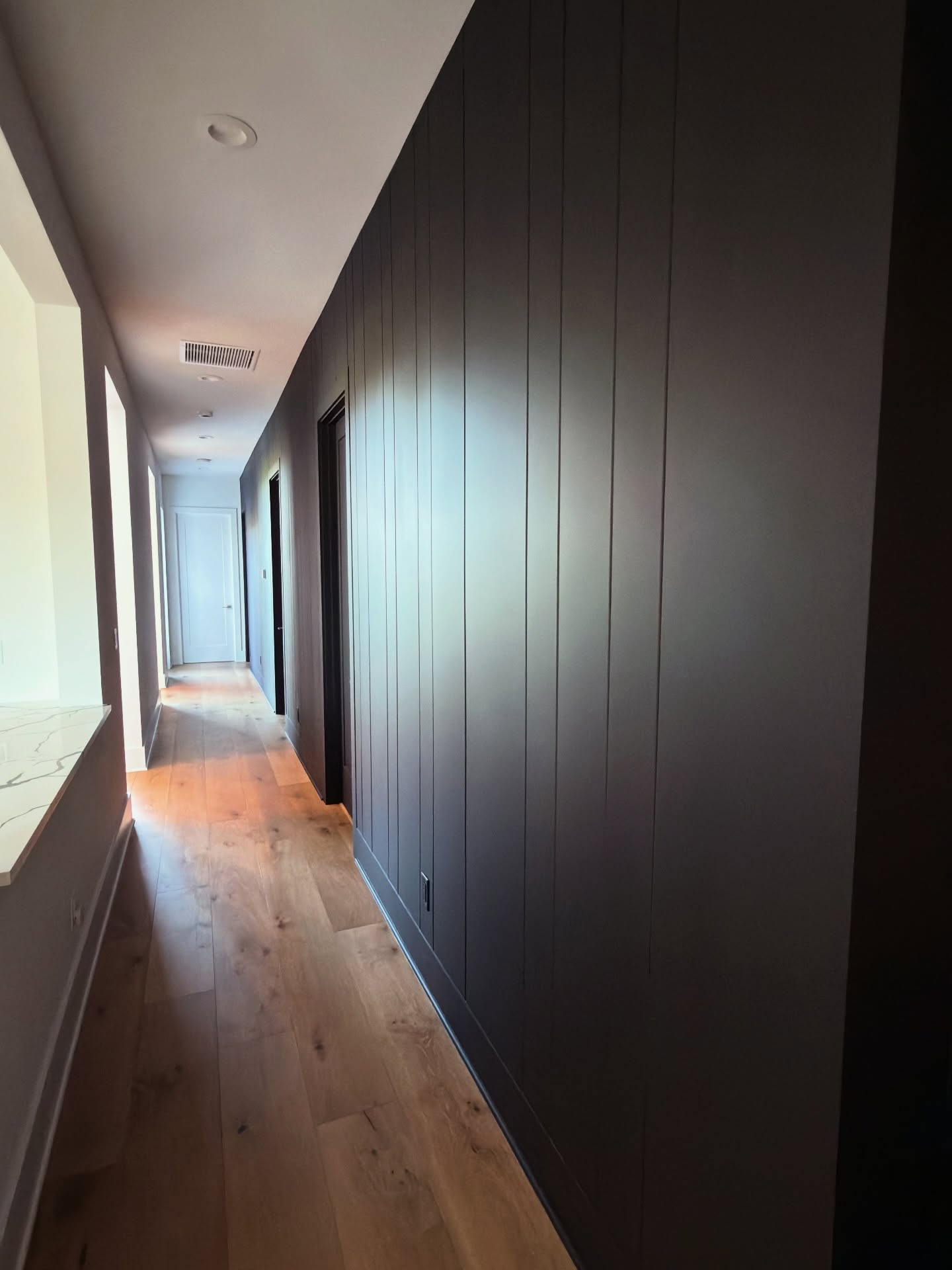 Painted shiplap feature wall by AVP Construction JAX — Jacksonville & St. John's County, FL